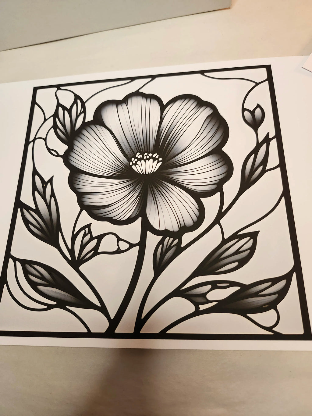 Black floral design on a white background