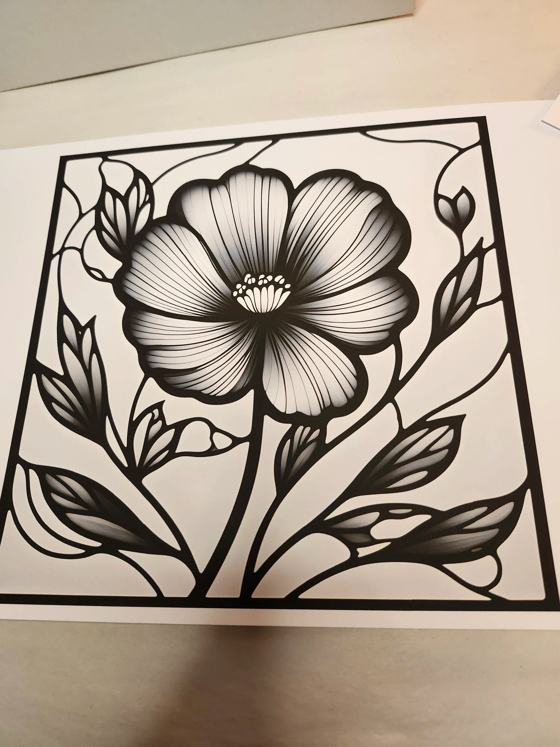 Black floral design on a white background