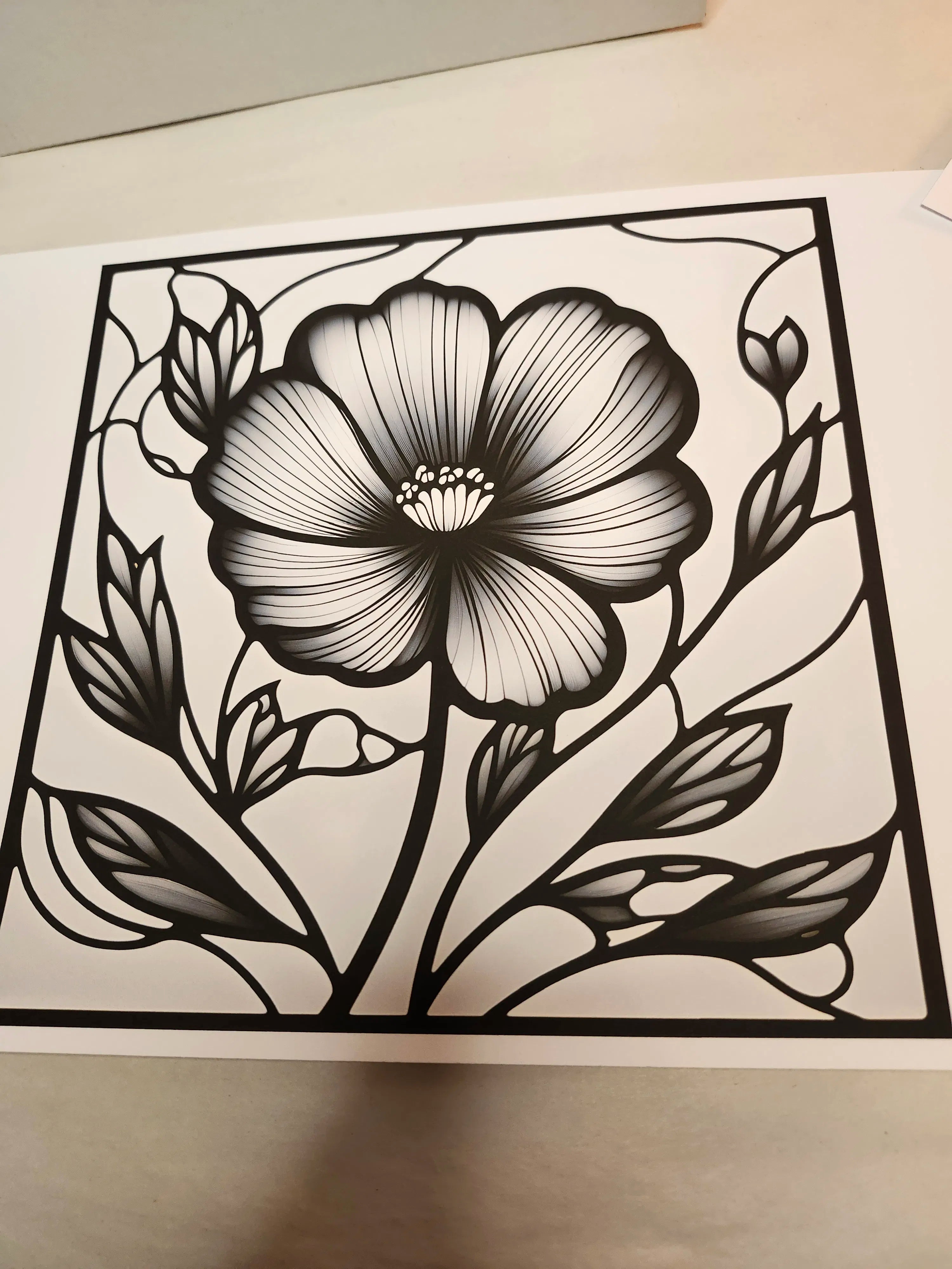 Black floral design on a white background
