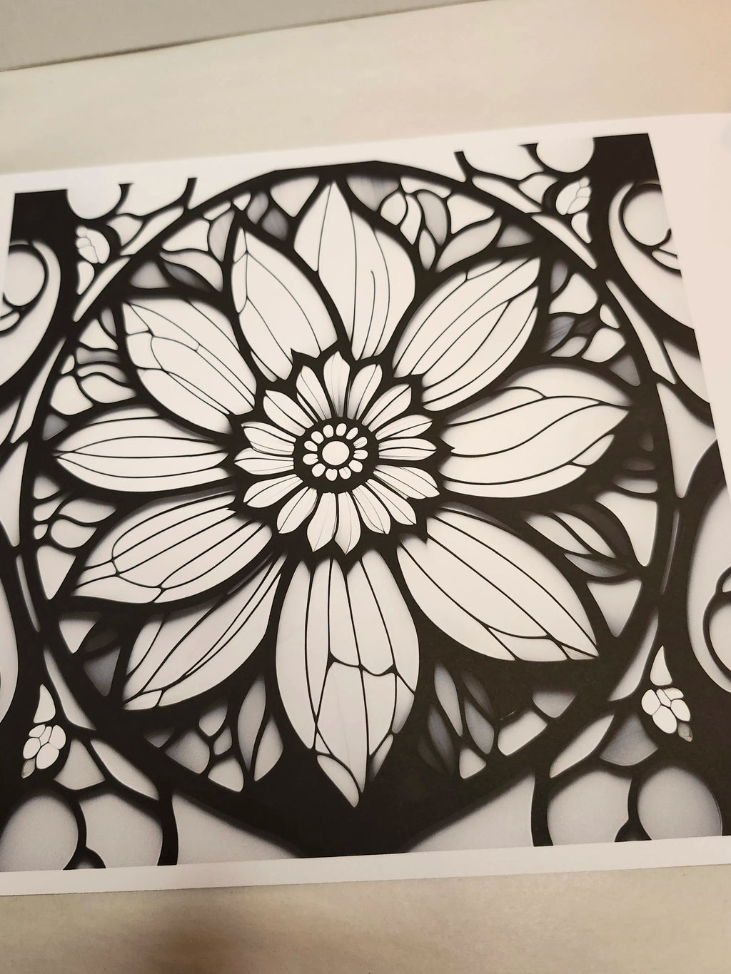 Black and white floral design on a white background