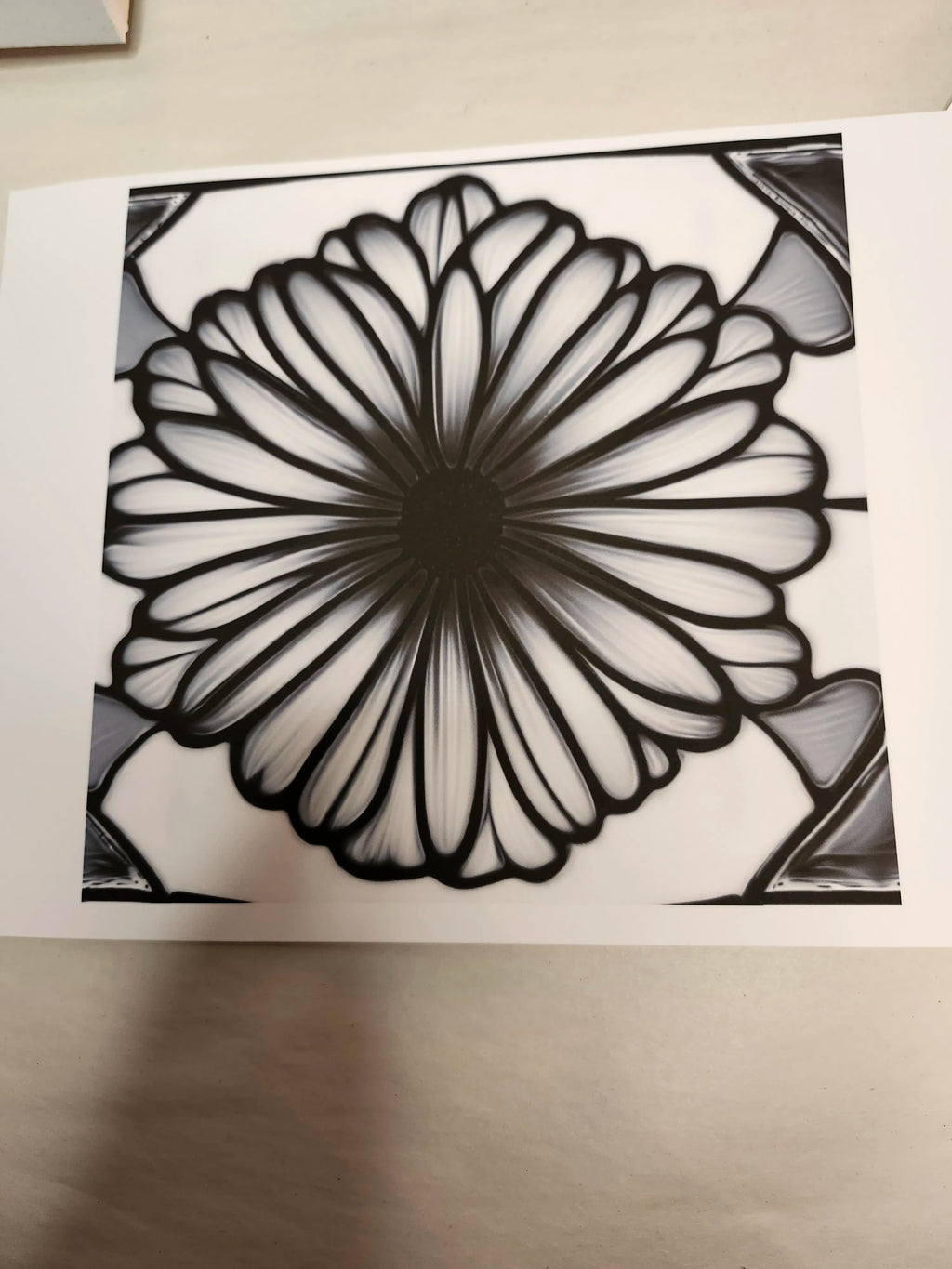 Black and white floral design on a white background