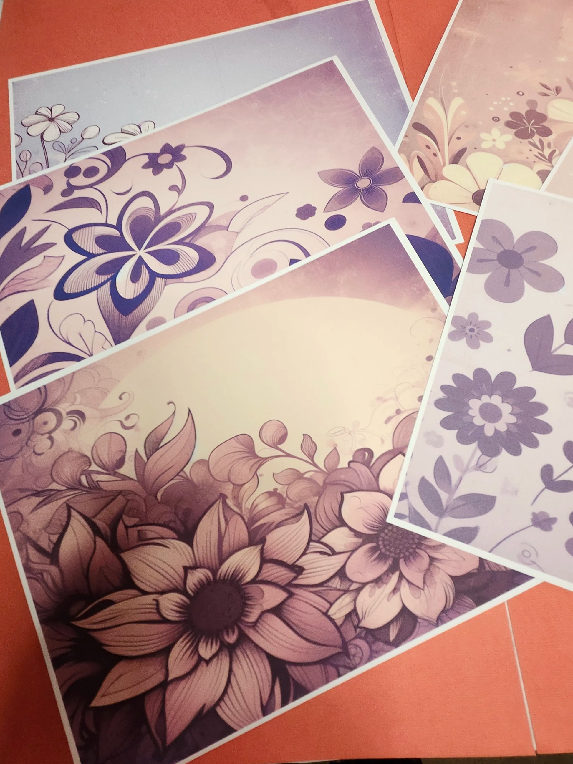 Floral patterned paper sheets on a red background