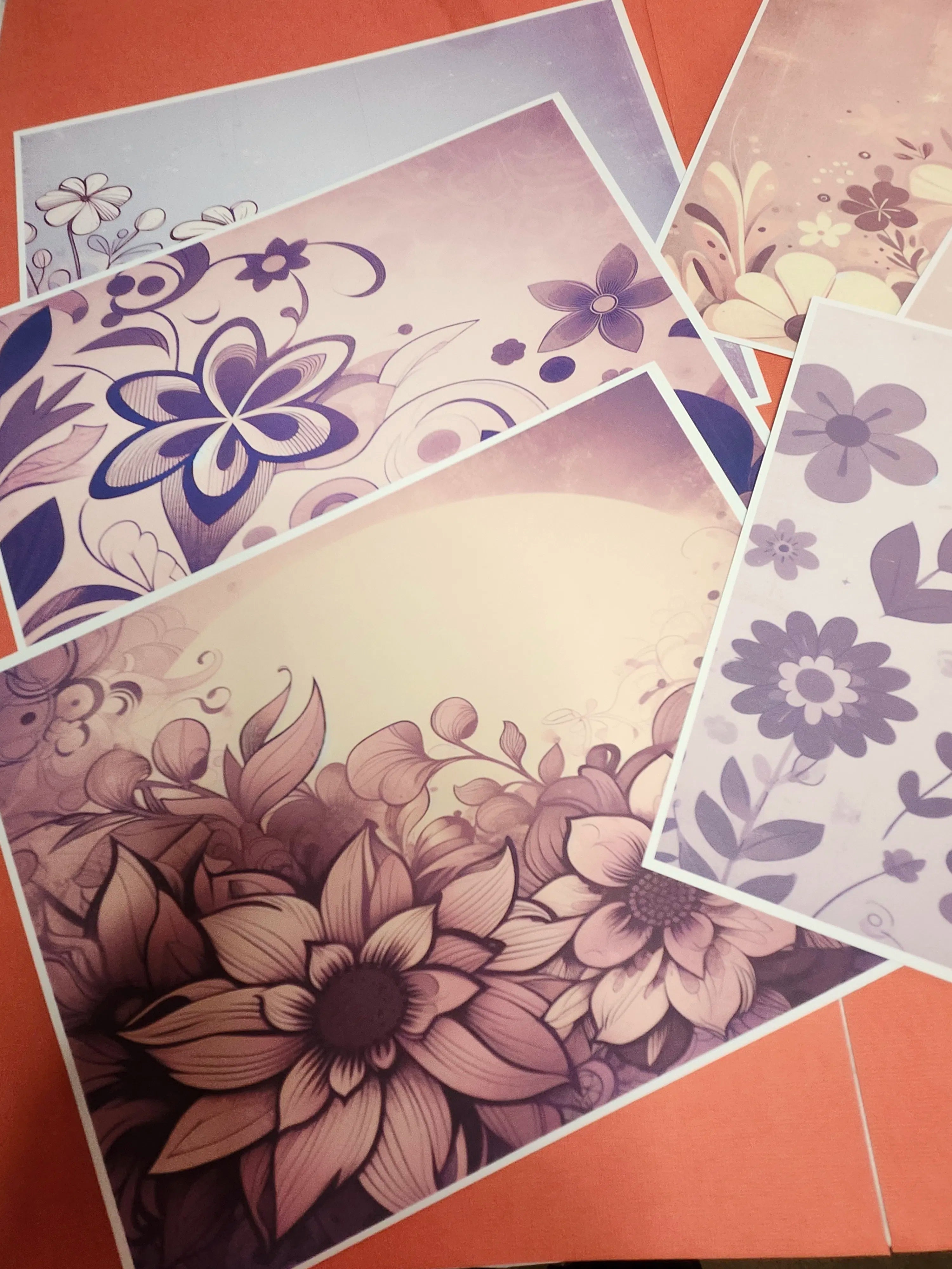 Floral patterned paper sheets on a red background