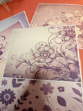Floral patterned paper sheets on a textured surface