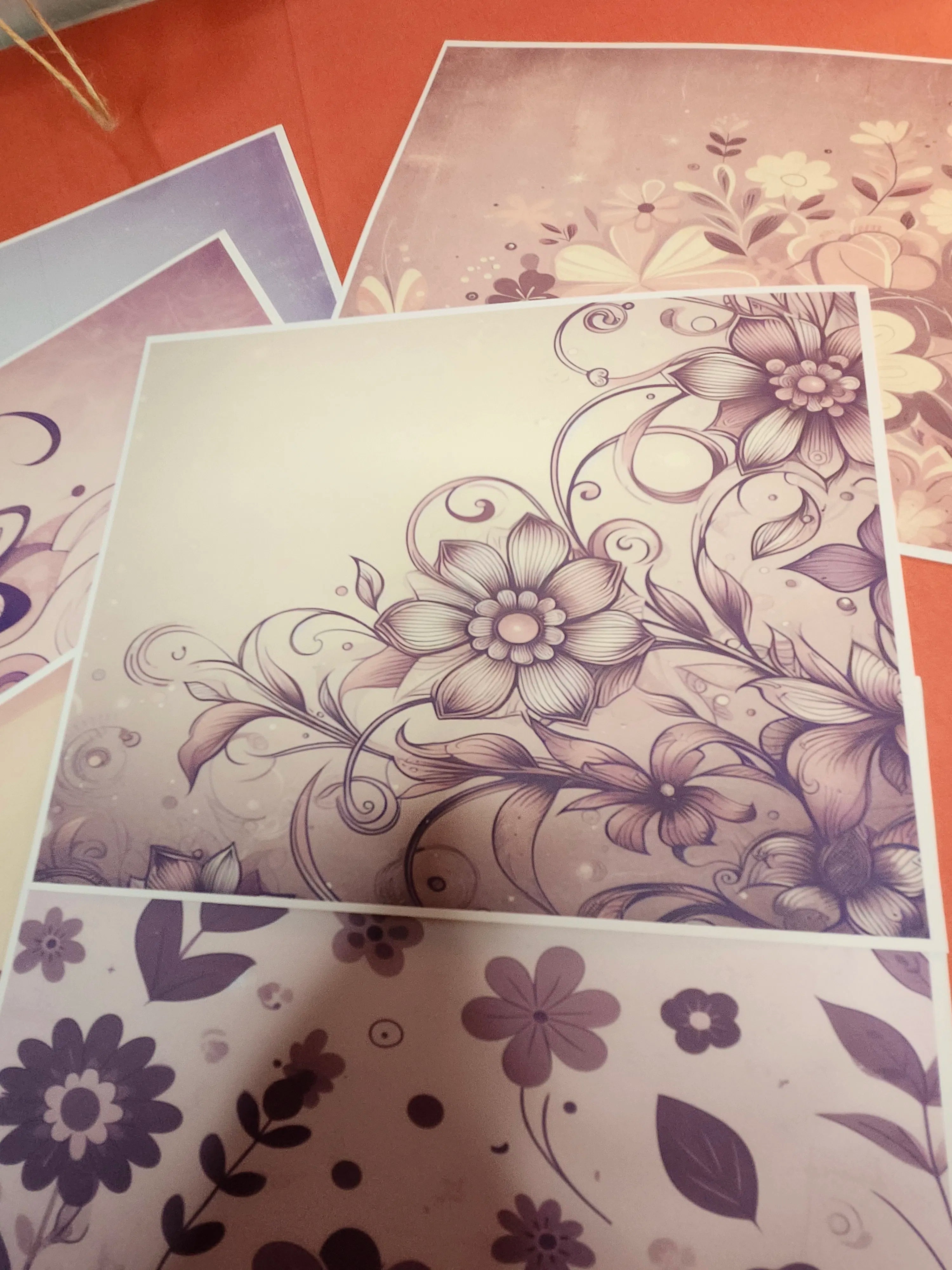 Floral patterned paper sheets on a textured surface