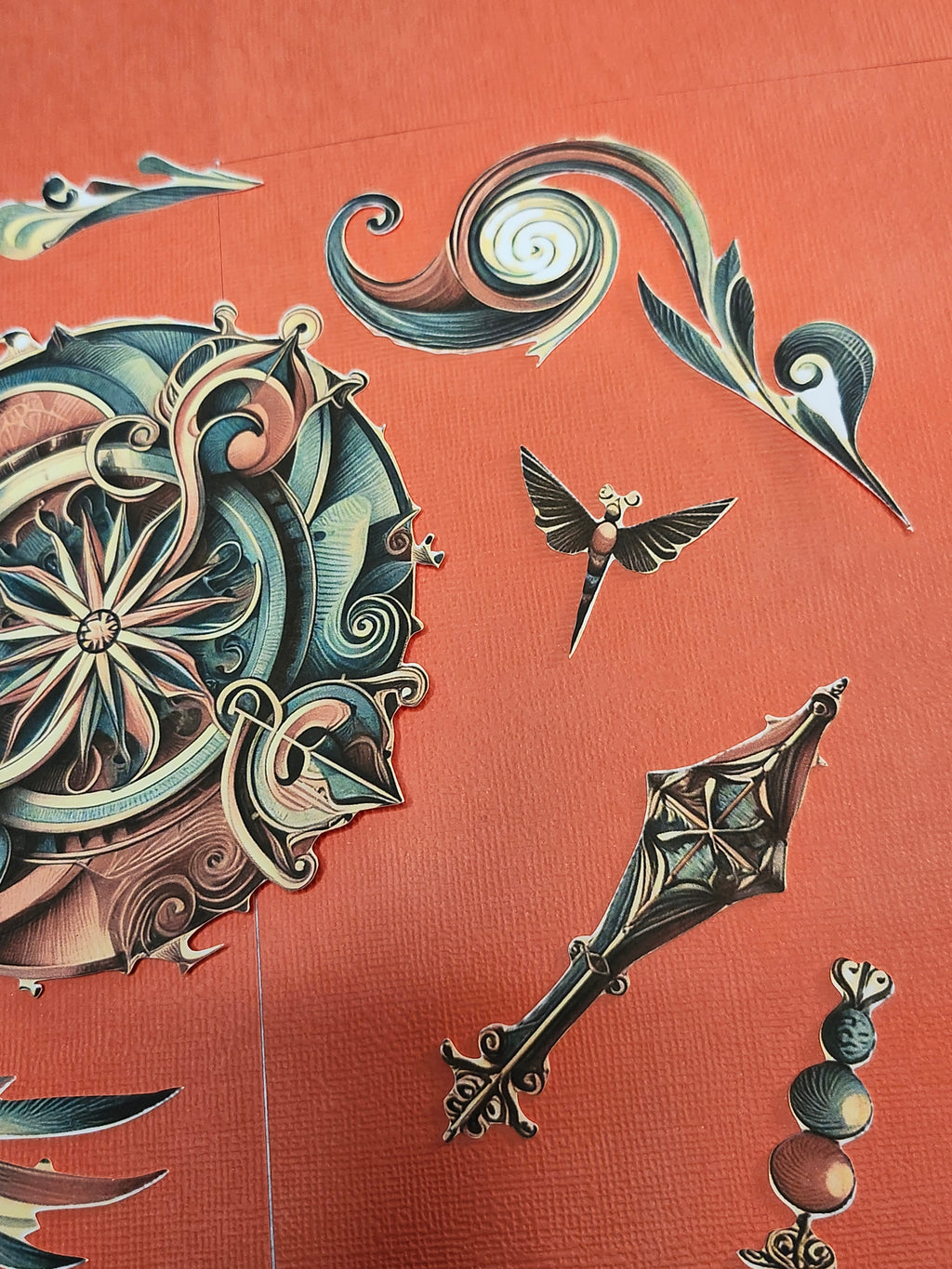 Decorative elements including a key, bird, and intricate designs on a red background