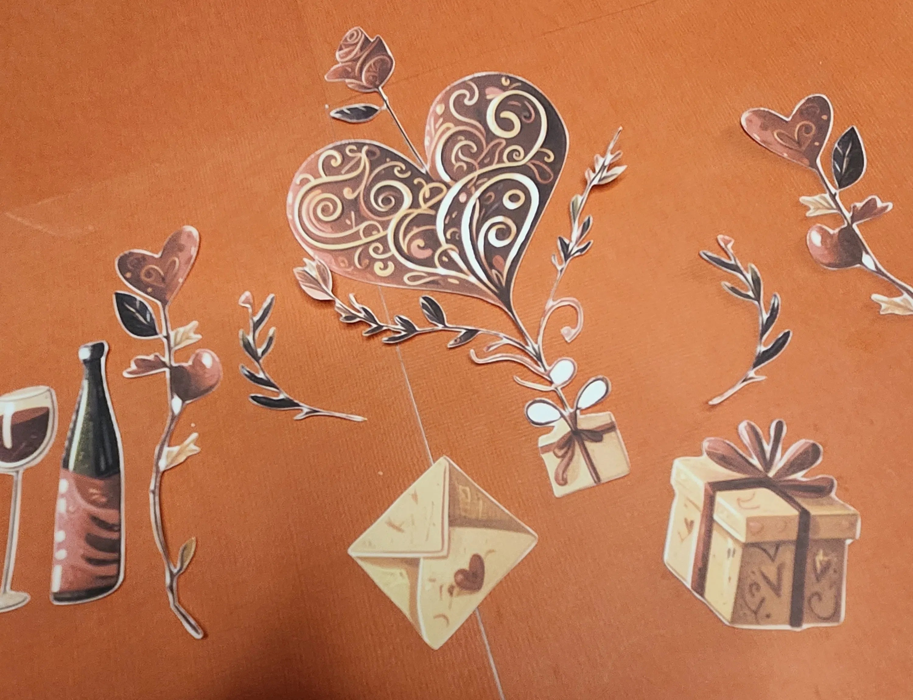 Decorative elements including a heart, gift box, envelope, and bottle on an orange background