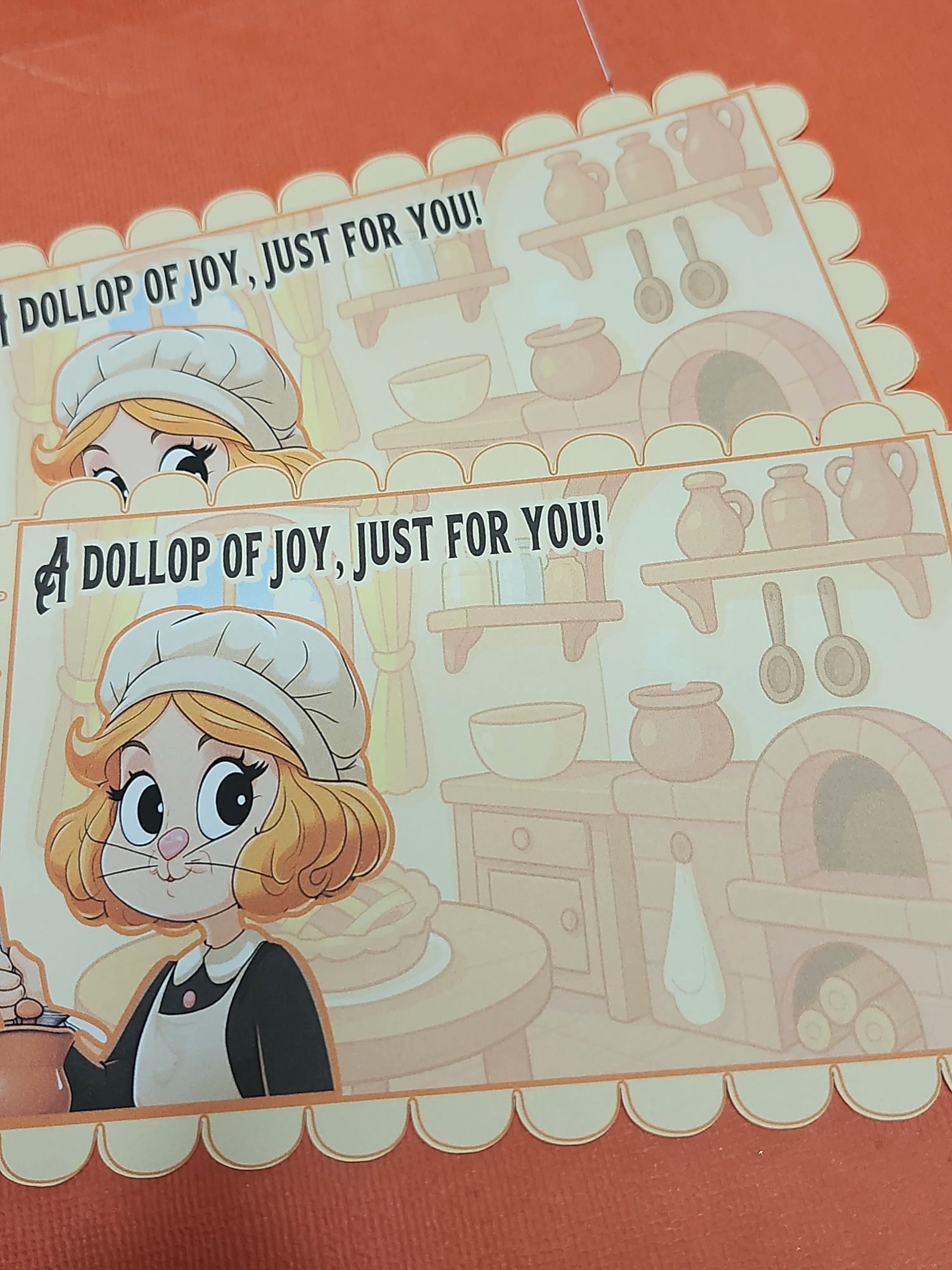 Illustration of a character with text 'A DOLLOP OF JOY, JUST FOR YOU!' in a kitchen setting.