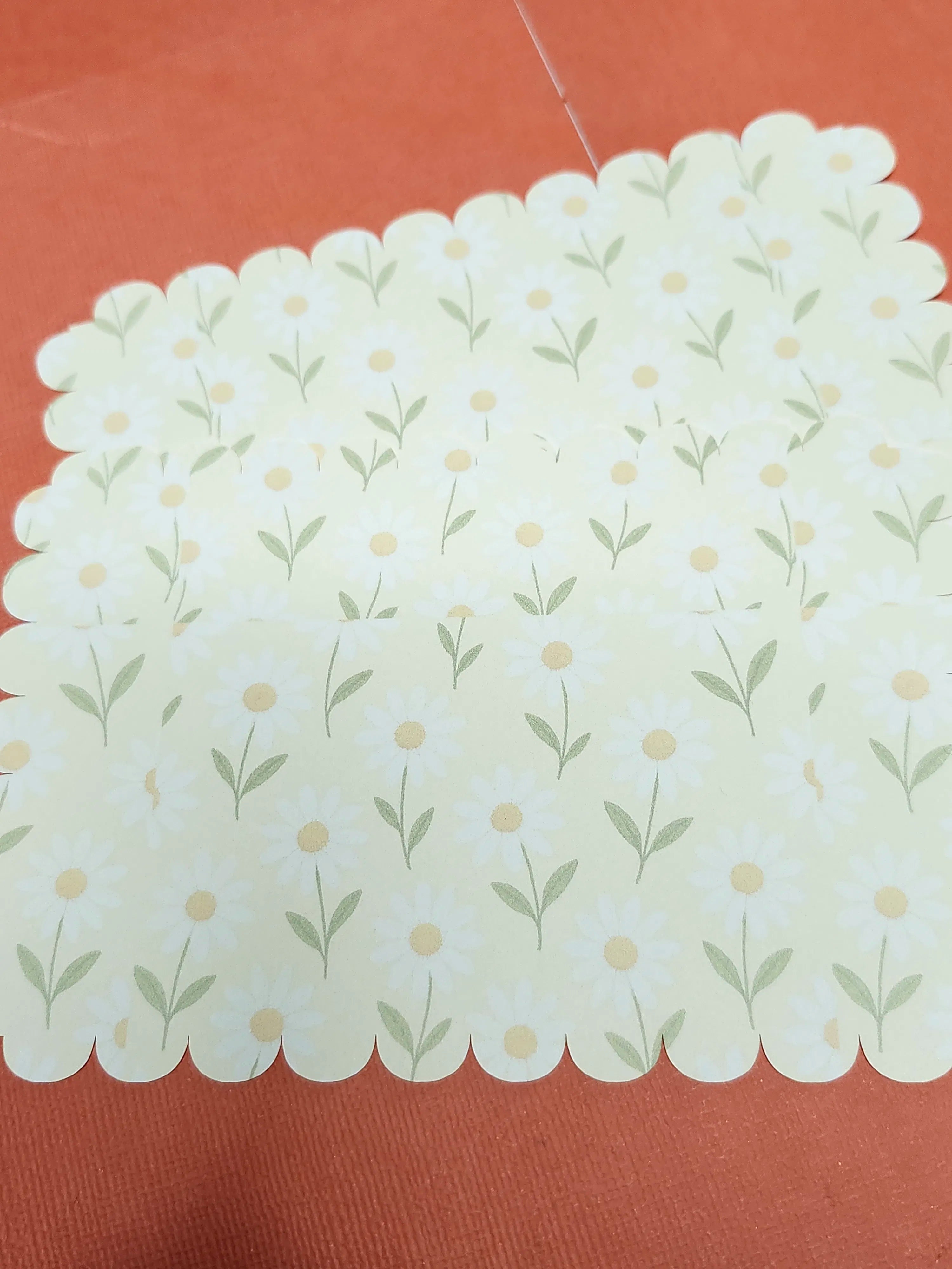 Decorative paper with floral pattern on a red background
