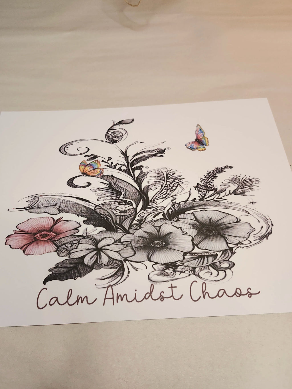 Floral illustration with butterflies and 'Calm Amidst Chaos' text on a white background