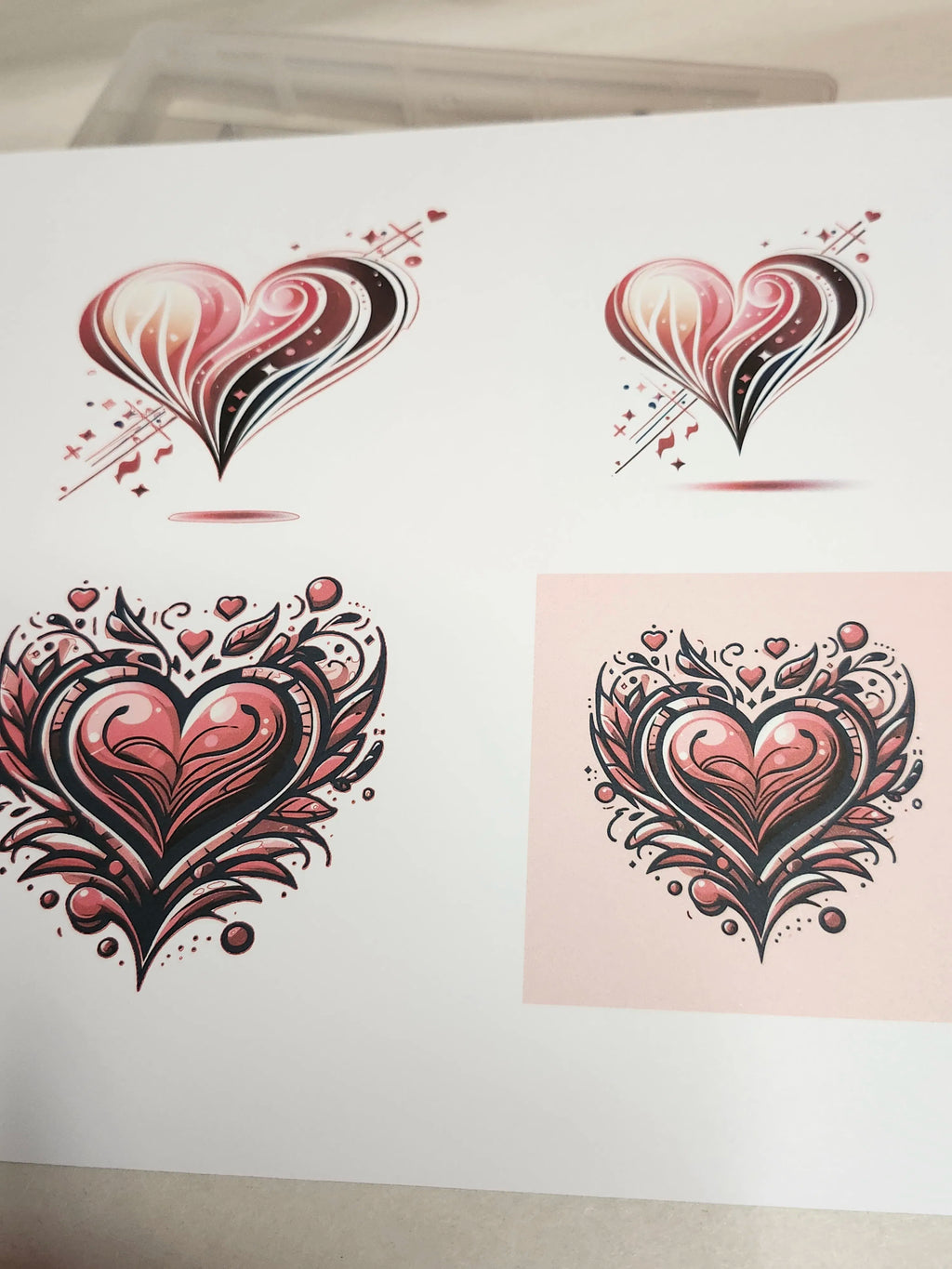 Four stylized heart designs on a white background