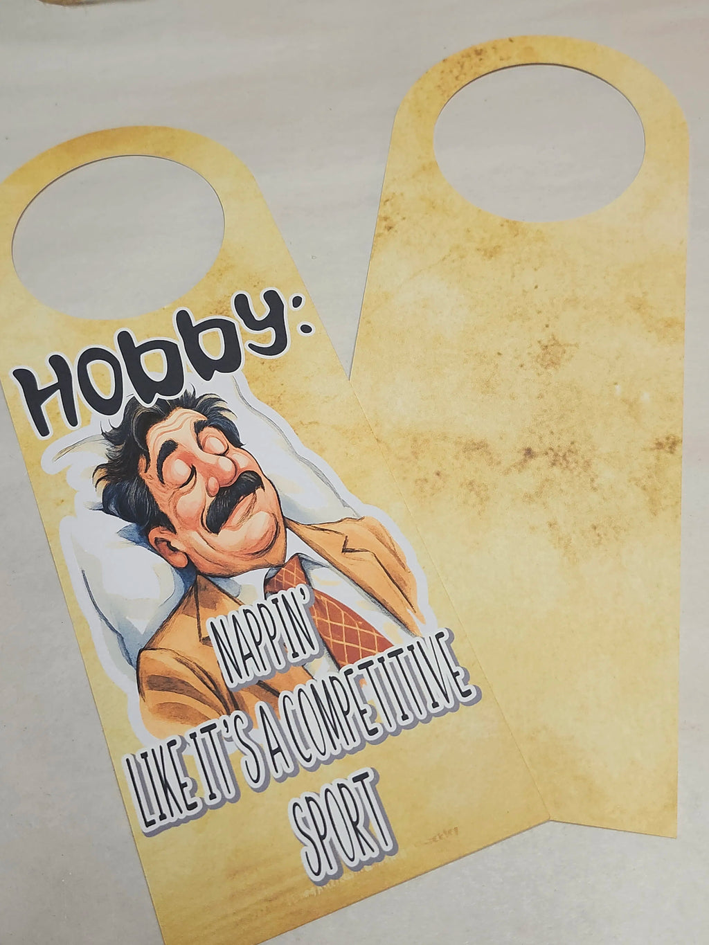 Door hanger with a cartoon character and text on a beige background