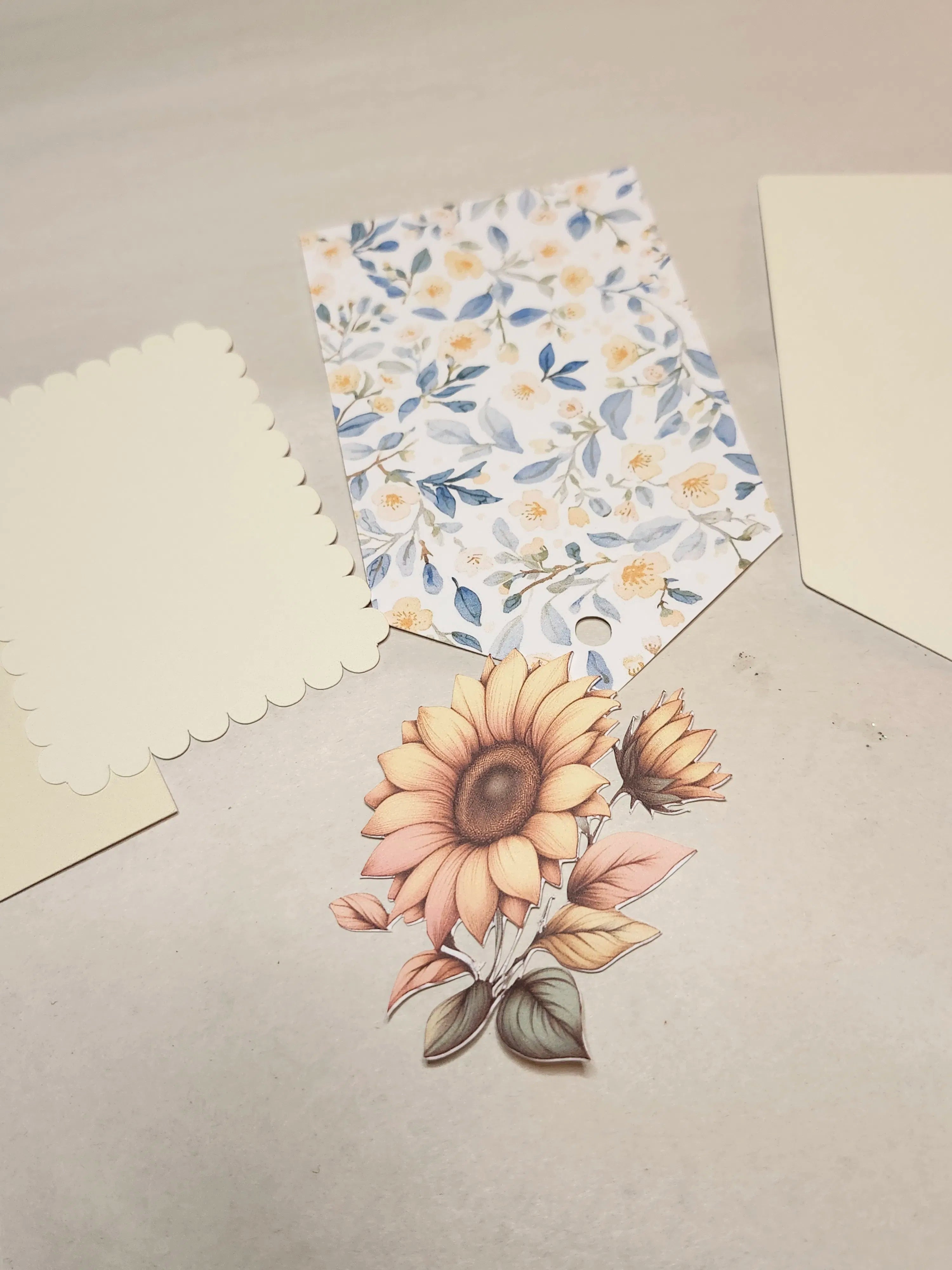 Floral-patterned fabric and sunflower illustration on a neutral background