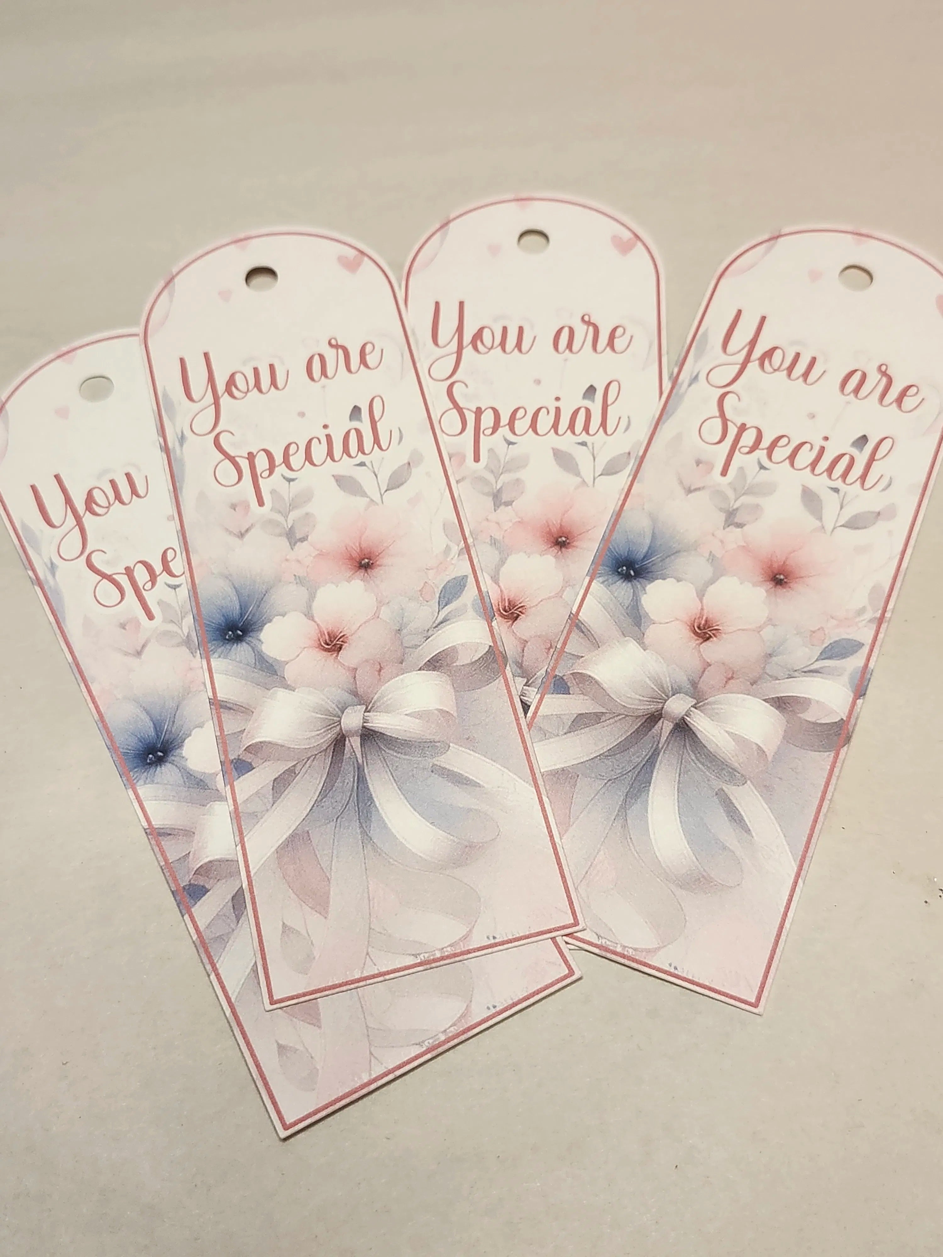 Three decorative tags with floral designs and 'You are Special' text on a light gray background.