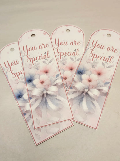 Three decorative tags with floral designs and 'You are Special' text on a light gray background.