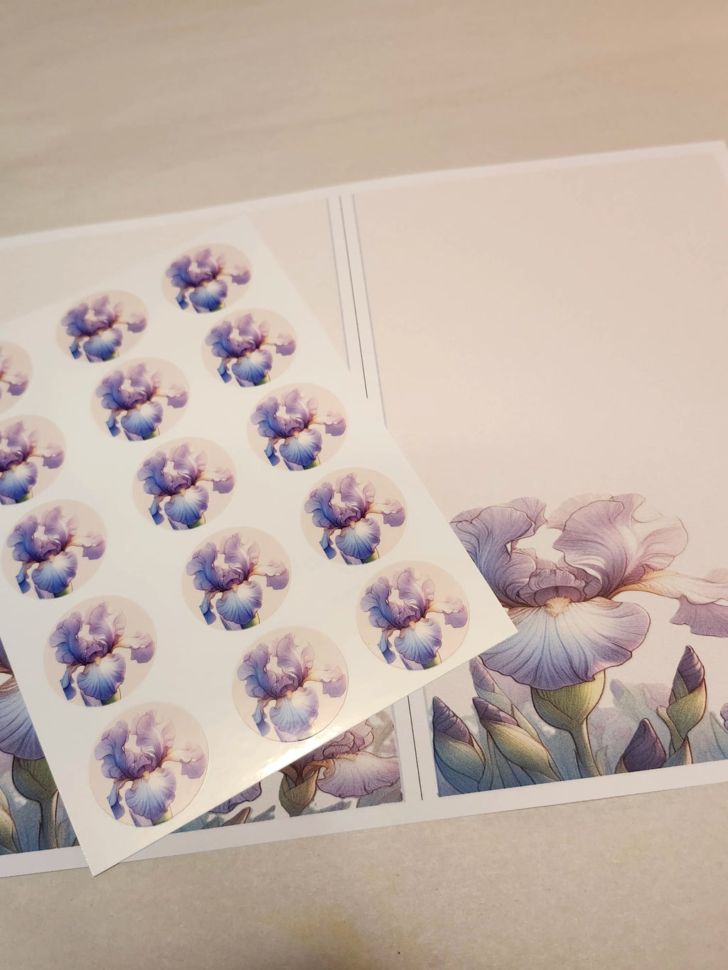 Sheet of floral stickers with purple and blue flowers on a white background