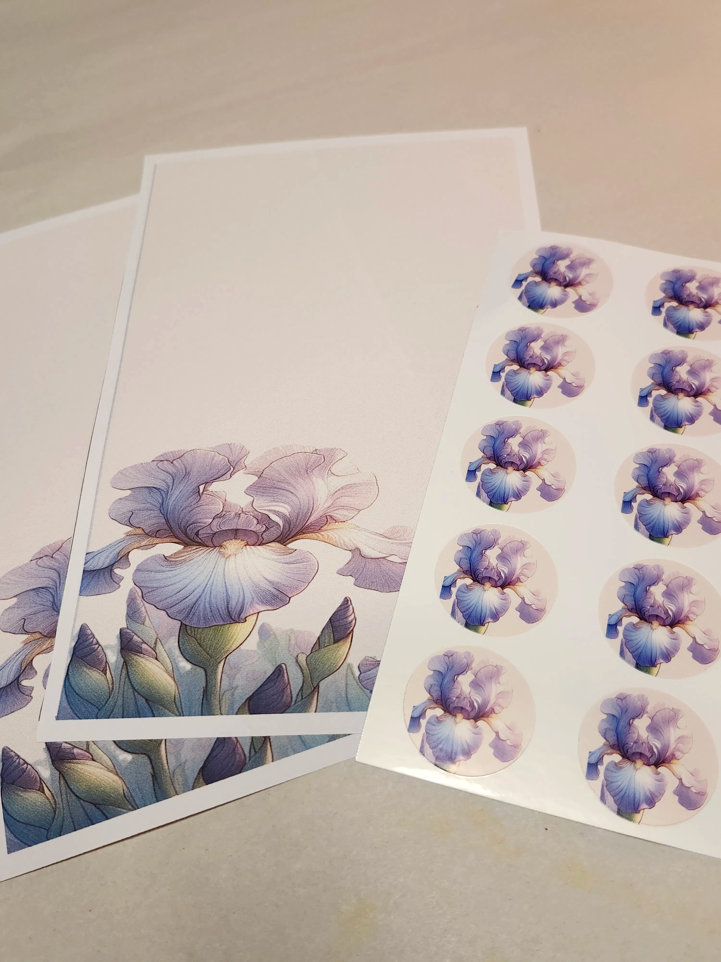 Floral card and matching stickers with purple flowers on a neutral background