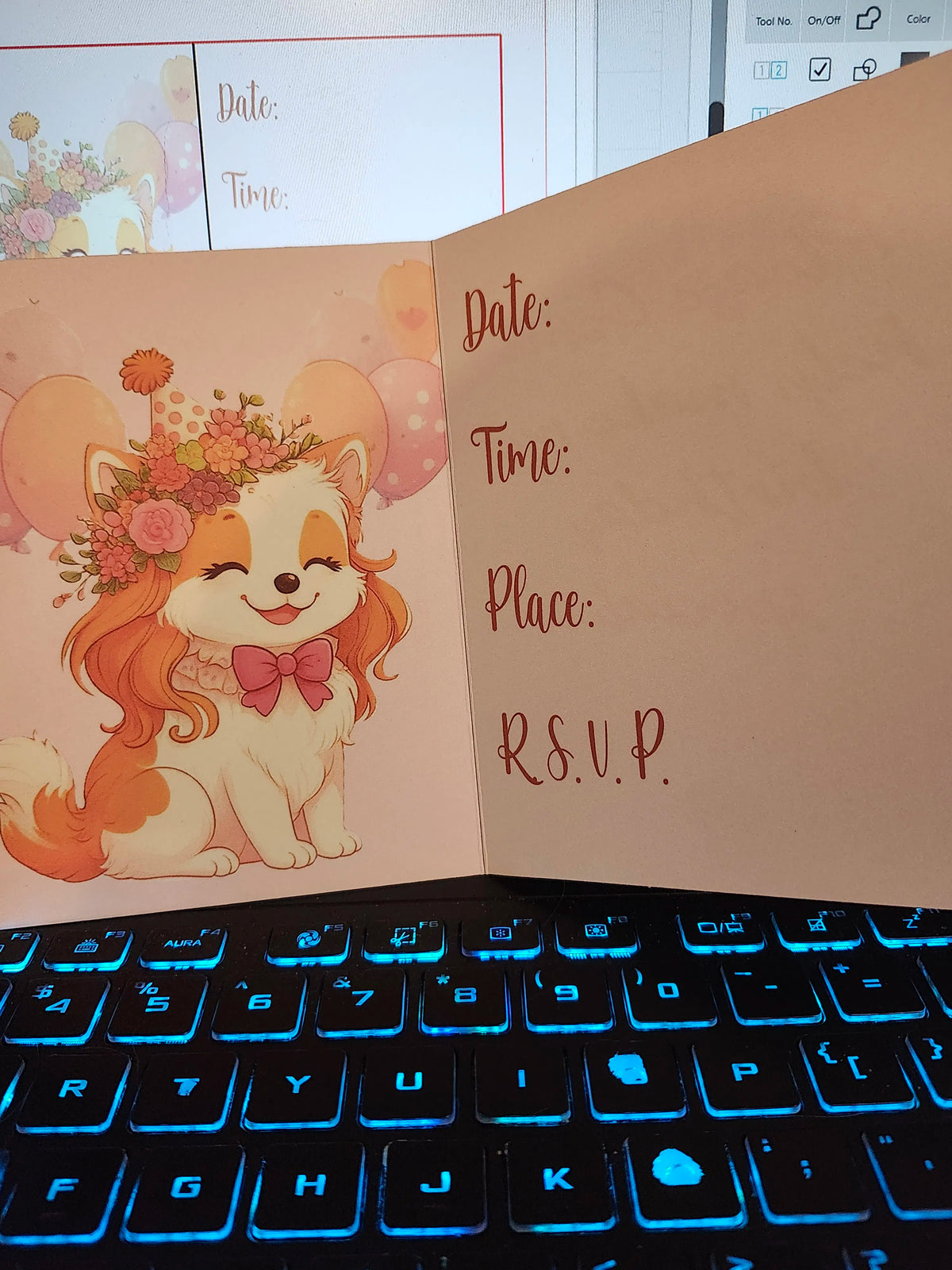 Invitation card with a cartoon dog and RSVP text on a keyboard