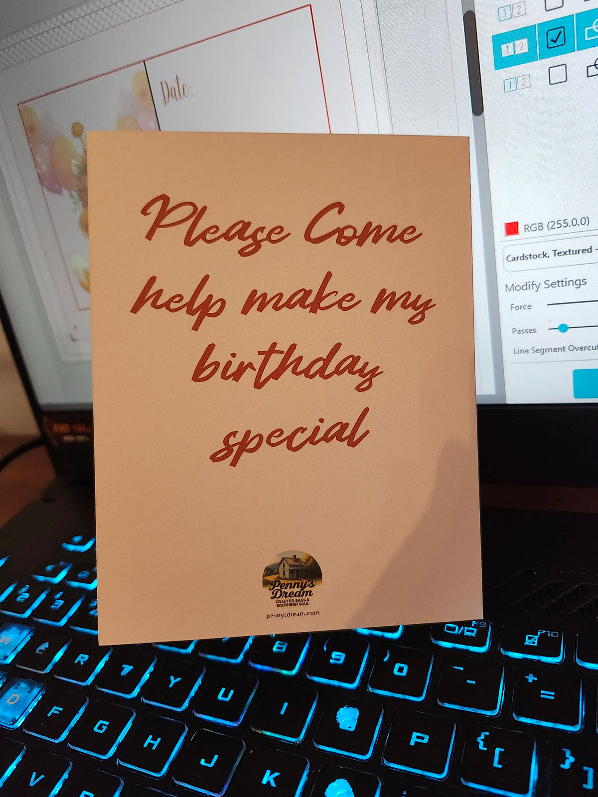 Brown card with red text on a computer keyboard