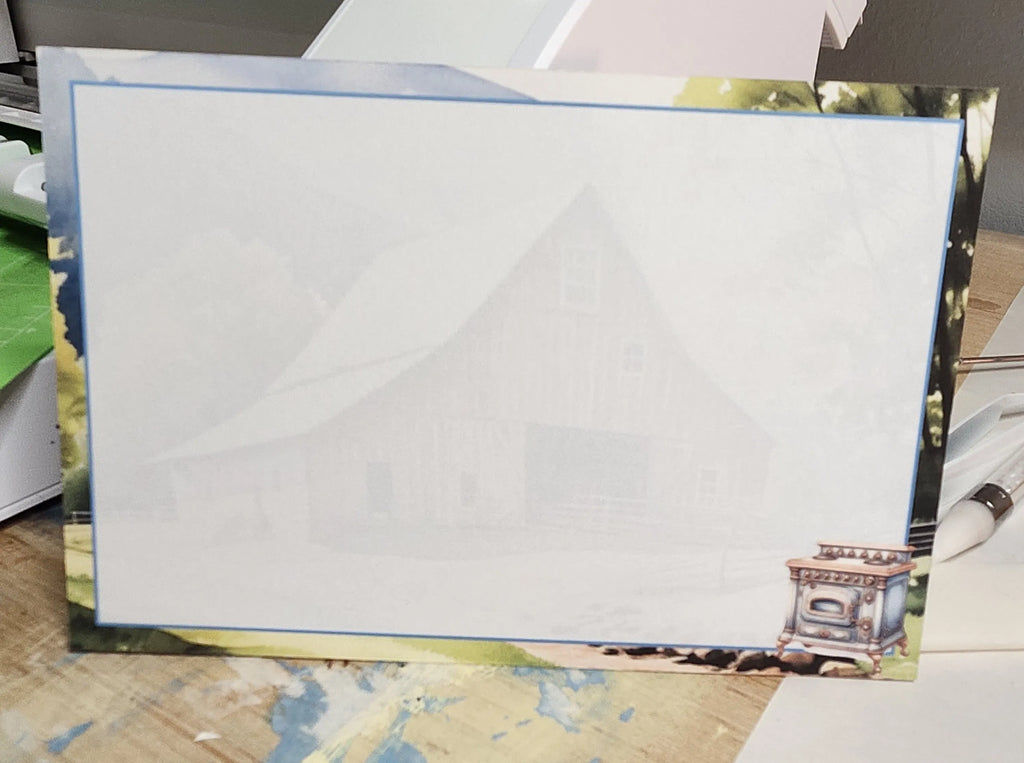 White paper with decorative border on a wooden surface