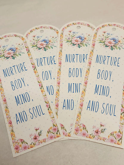 Four floral-themed tags with text on a neutral background