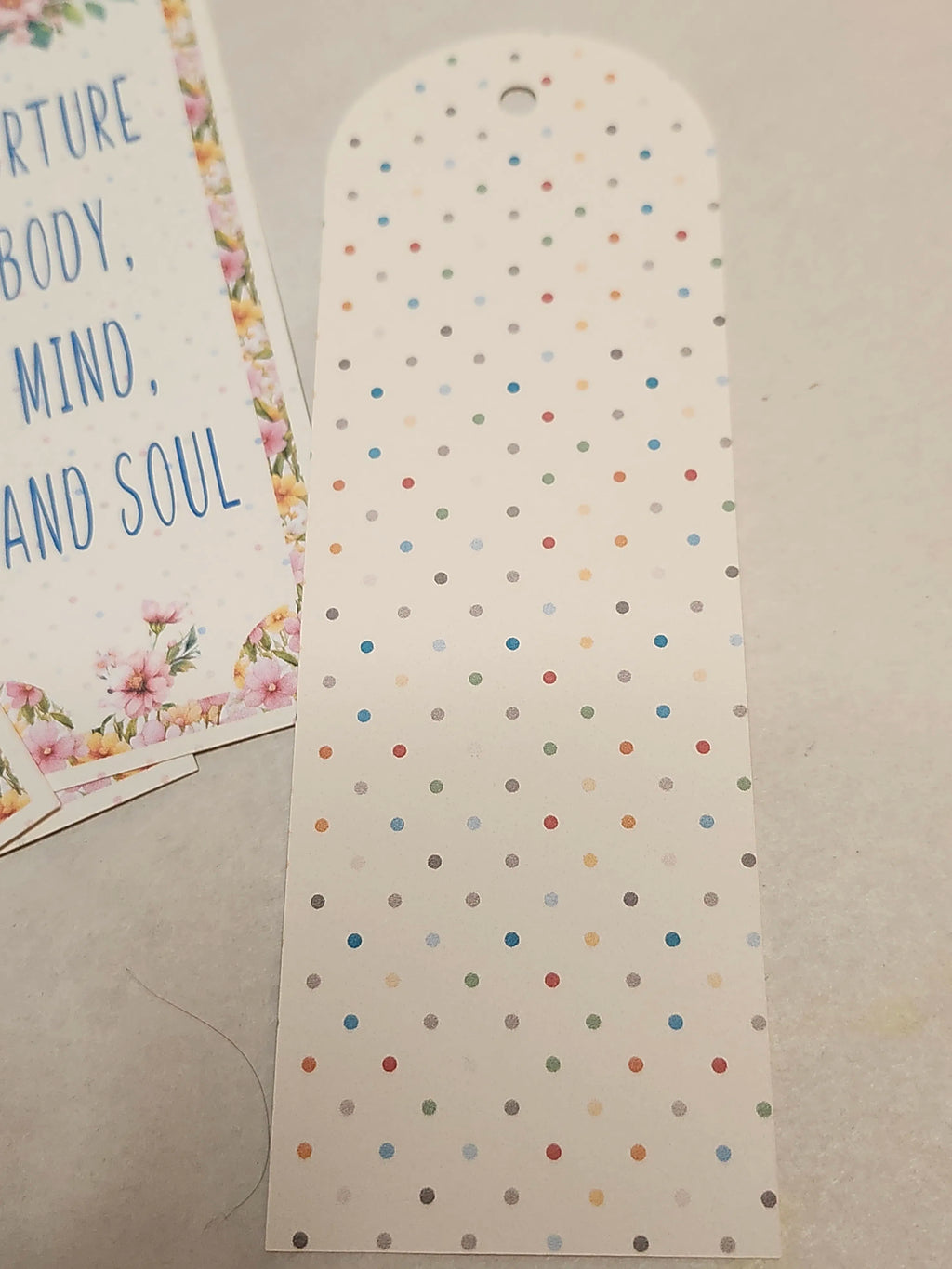Polka dot card with motivational text on a plain background