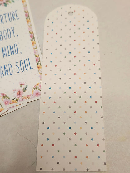 Polka dot card with motivational text on a plain background