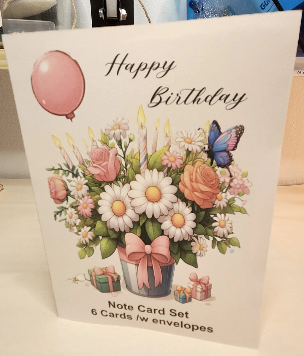 Packaging of a birthday card set with flowers, balloons, and a butterfly on a white background.