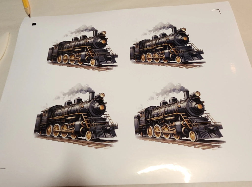 Four illustrations of a steam locomotive on a white sheet of paper.