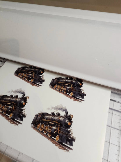 Printed steam locomotive design on a white surface with a grid pattern.