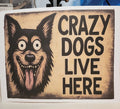 Wooden sign with a dog illustration and text 'Crazy Dogs Live Here' on a white background.