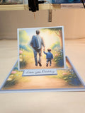 Greeting card with illustration of a father and child walking together, set against a scenic background.