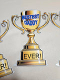 Gold trophy with 'Bestest Daddy Ever!' text on a beige background