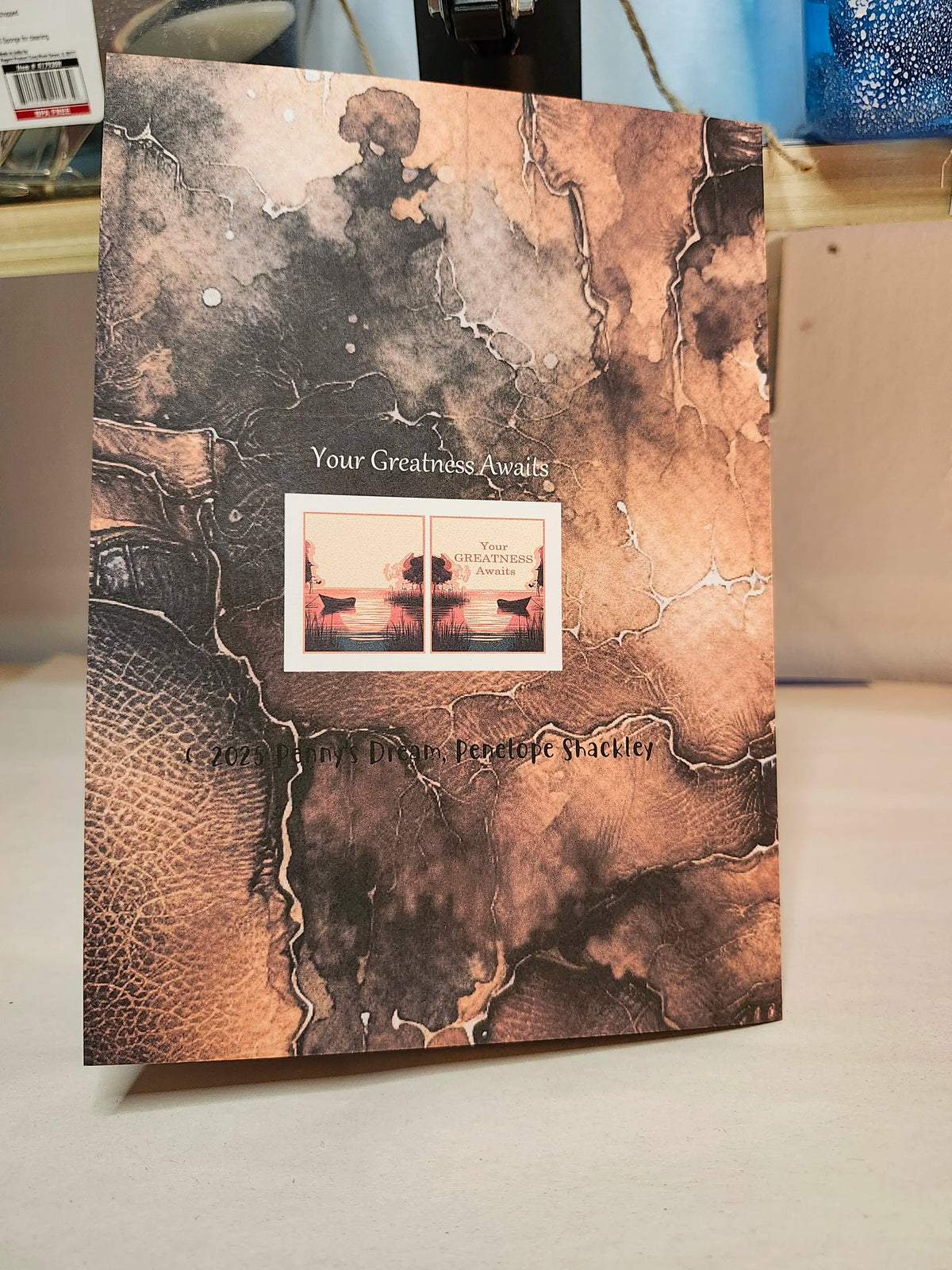 Book with textured cover and visible text on a neutral background