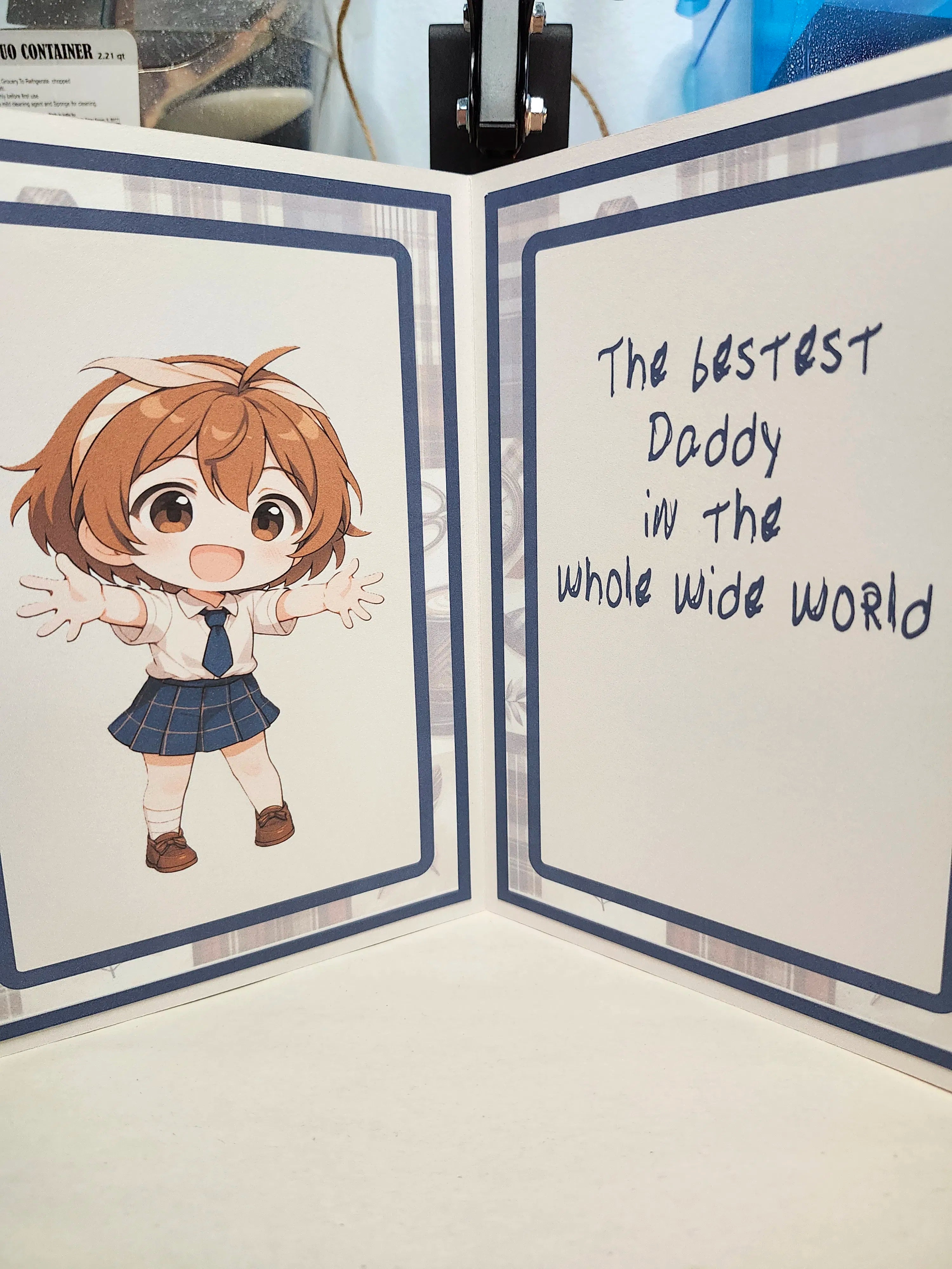 Card with an illustration of a character and text 'The bestest Daddy in the whole wide world' on a white background.