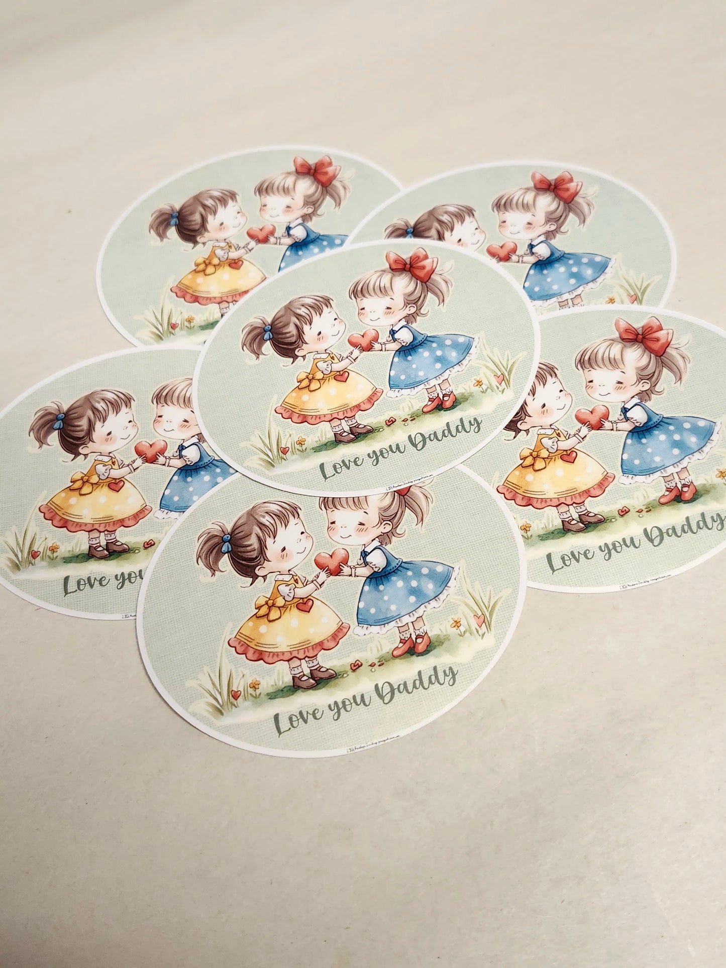 Set of decorative plates with cartoon girl design and 'Love you Daddy' text on a beige background.