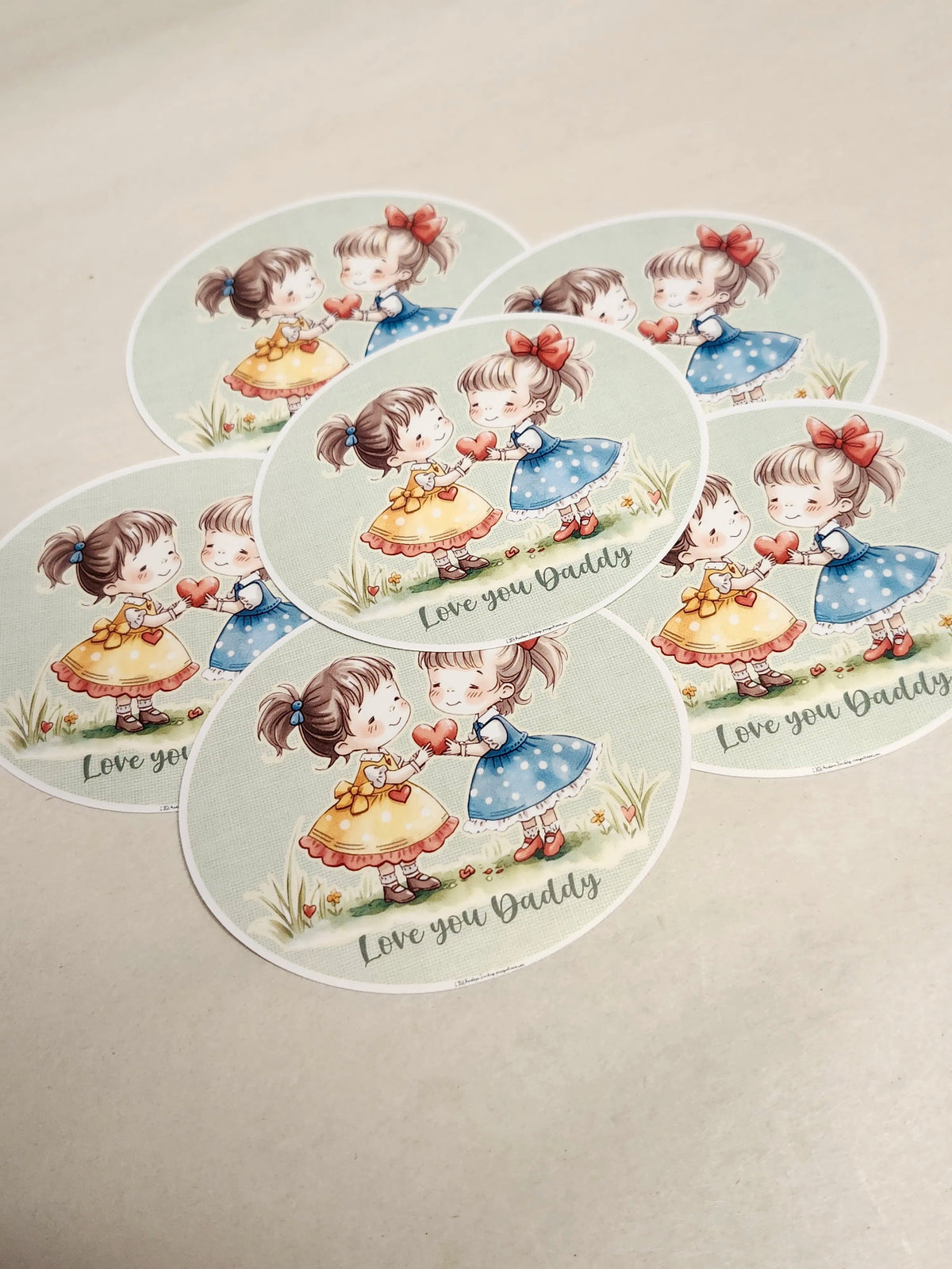Set of decorative plates with cartoon girl design and 'Love you Daddy' text on a beige background.
