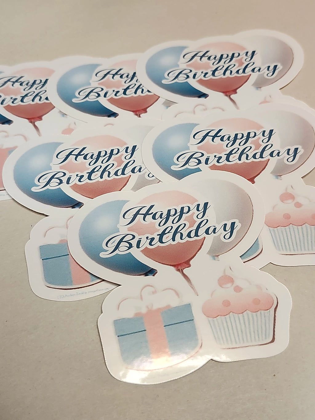 Stickers with 'Happy Birthday' text and festive graphics on a gray background