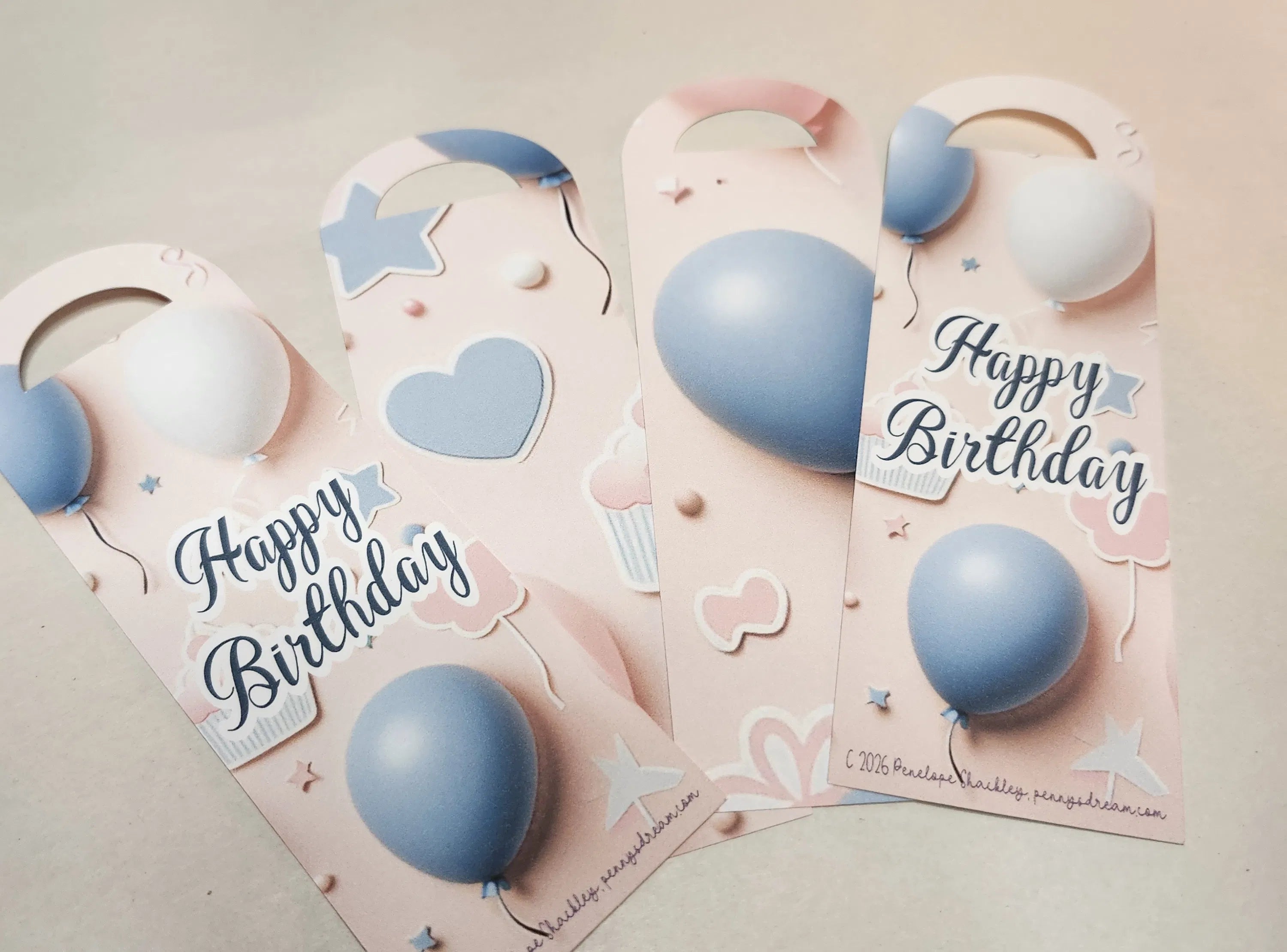 Three decorative birthday cards with blue balloons and 'Happy Birthday' text on a light background.