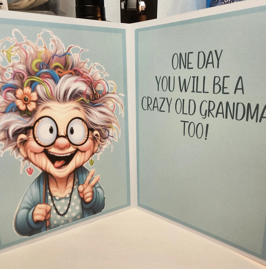 Cartoon illustration of an elderly woman with colorful hair and glasses, accompanied by text on a greeting card.