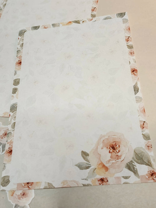 Floral-patterned fabric with a prominent rose design on a plain background