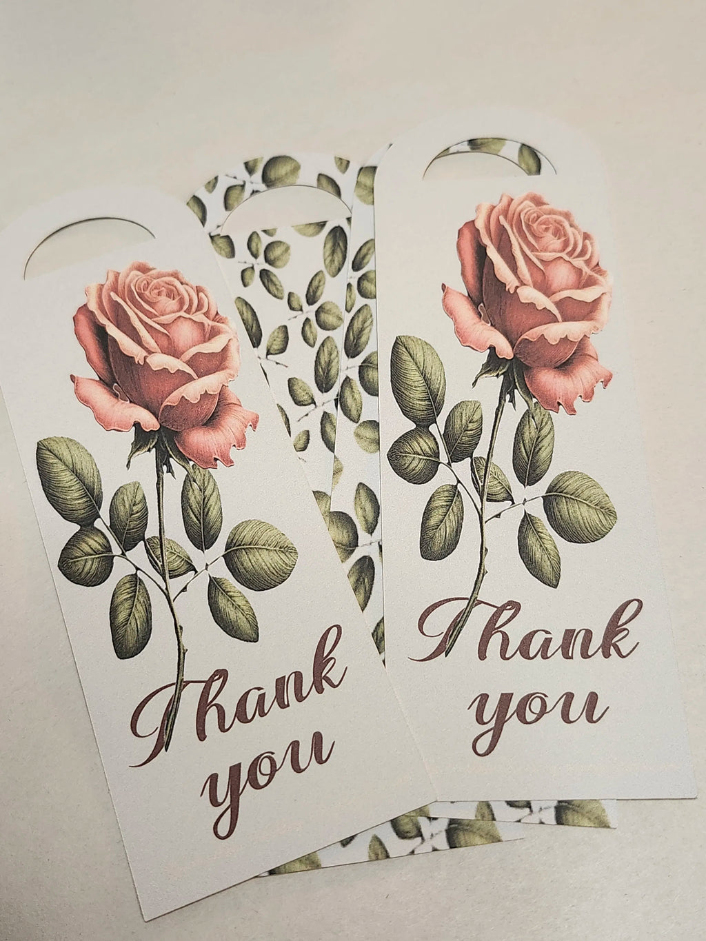 Two floral bookmarks with roses and 'Thank you' text on a light background