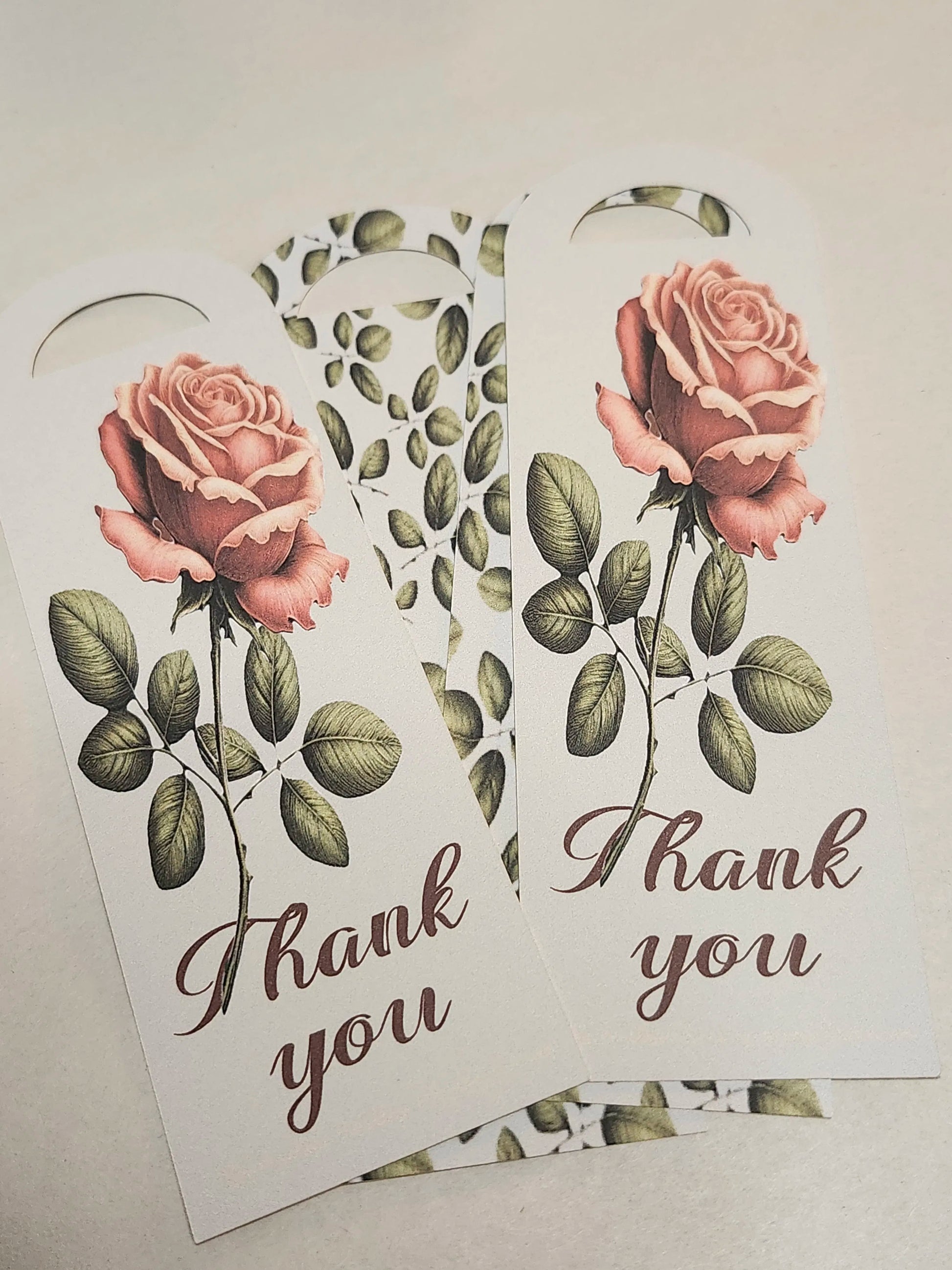 Two floral bookmarks with roses and 'Thank you' text on a light background