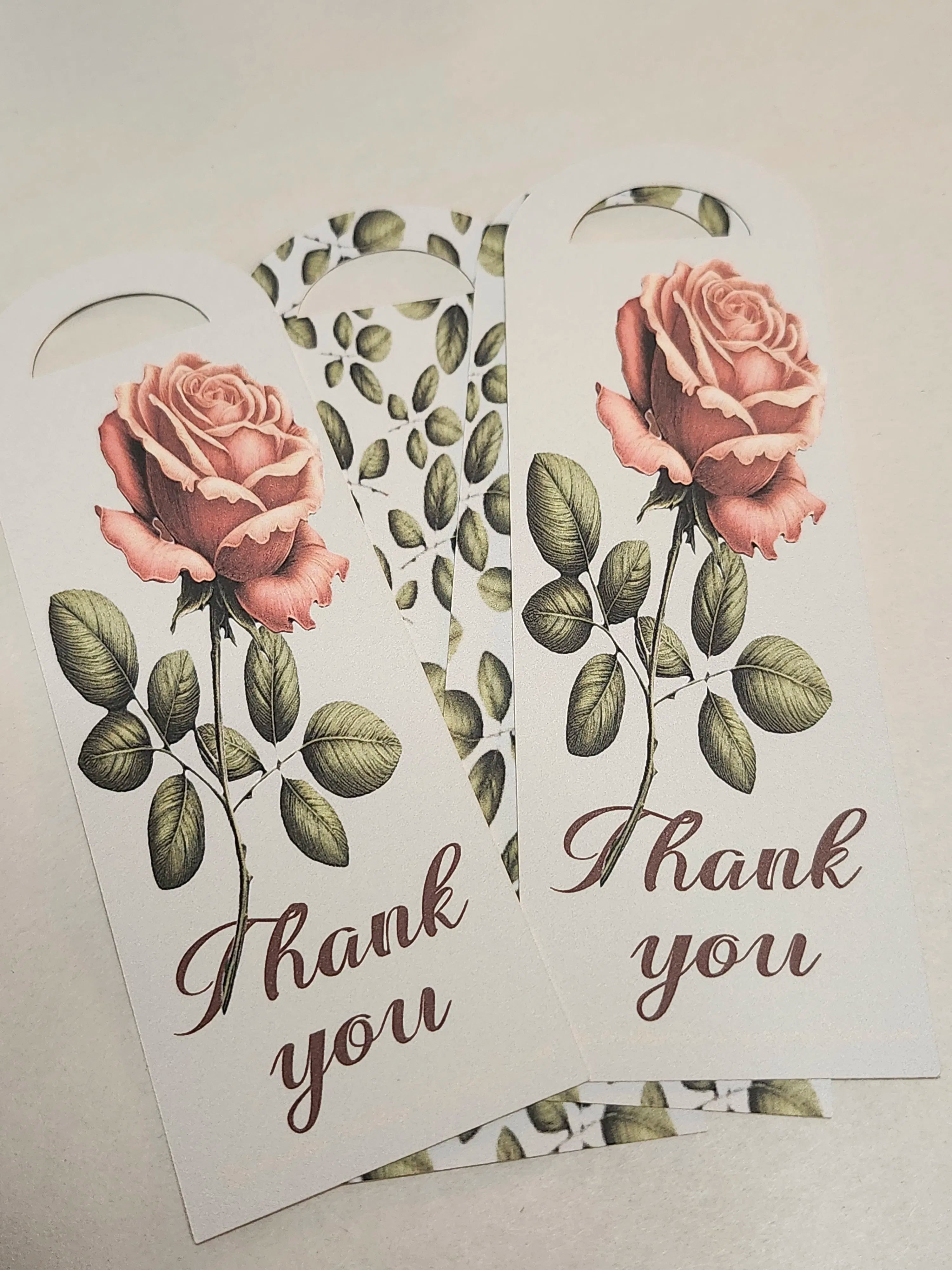 Two floral bookmarks with roses and 'Thank you' text on a light background