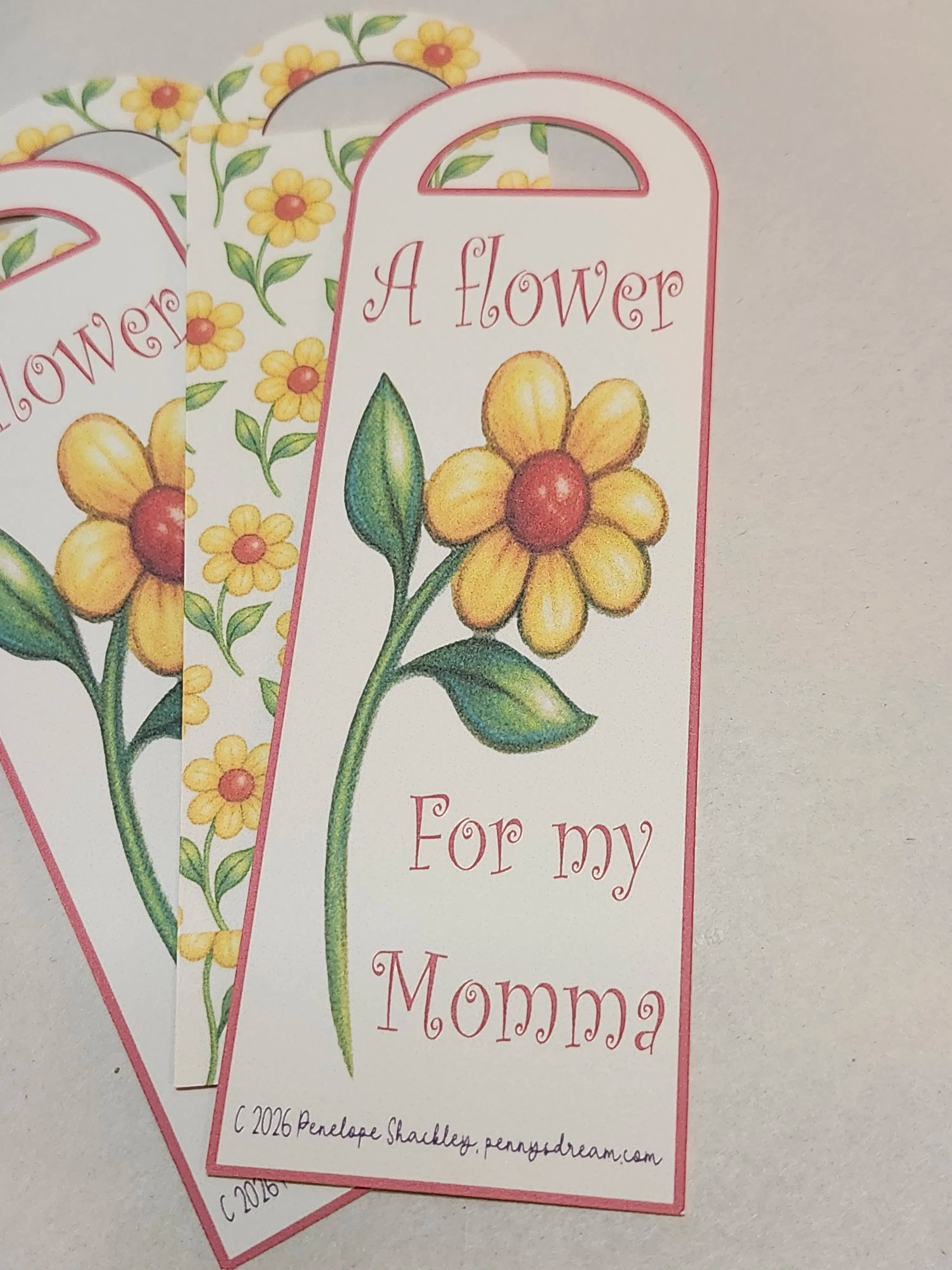 Floral bookmark with text 'A flower for my Momma' on a light background