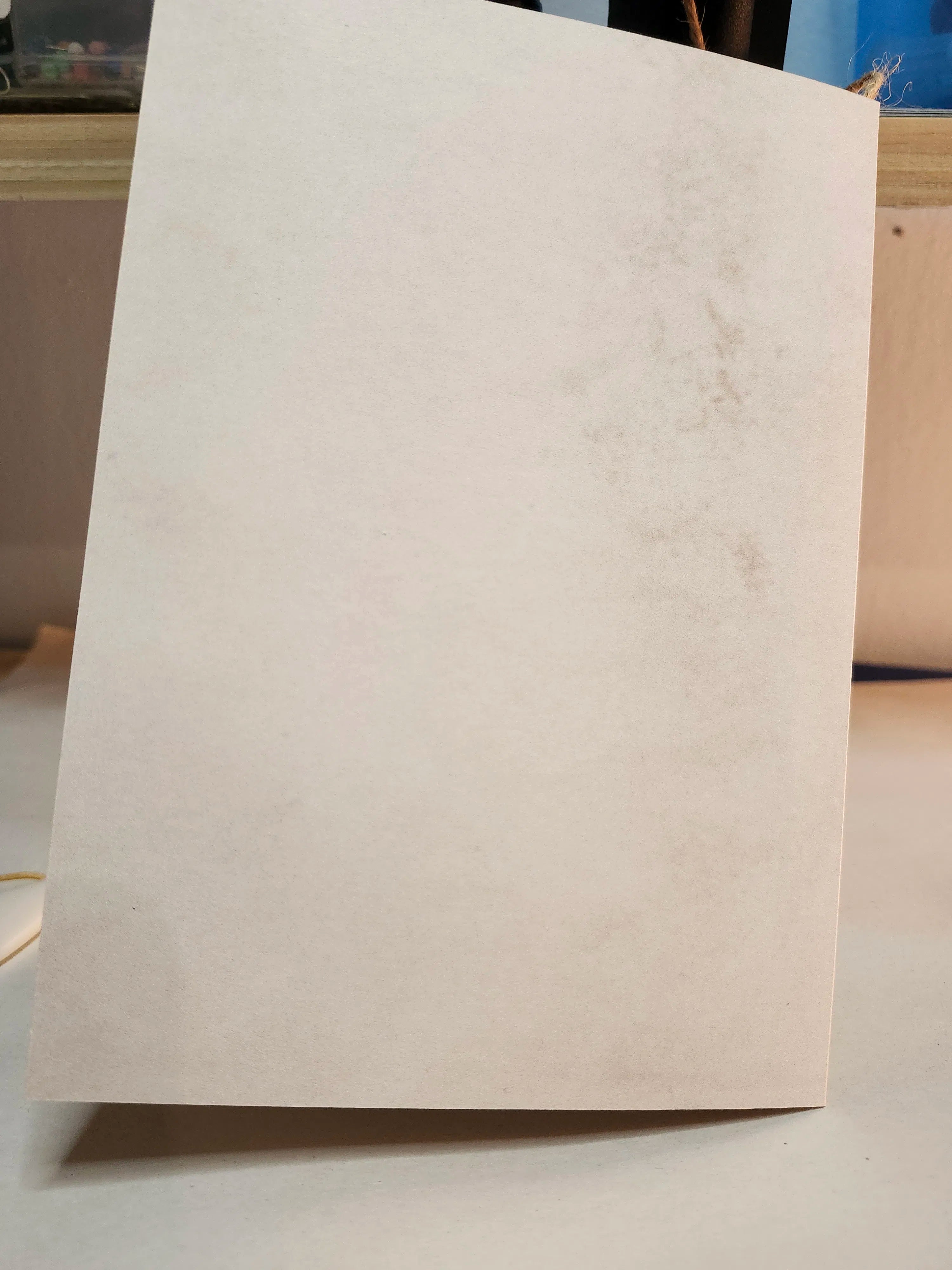 Beige paper on a white surface