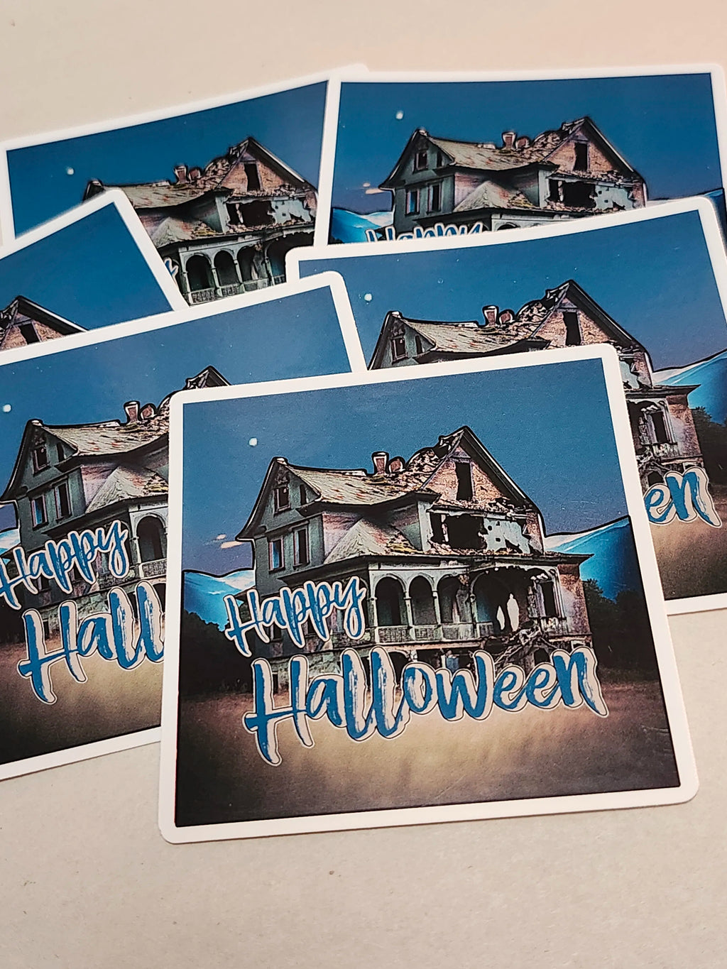Set of Halloween-themed stickers with haunted house illustrations and 'Happy Halloween' text.