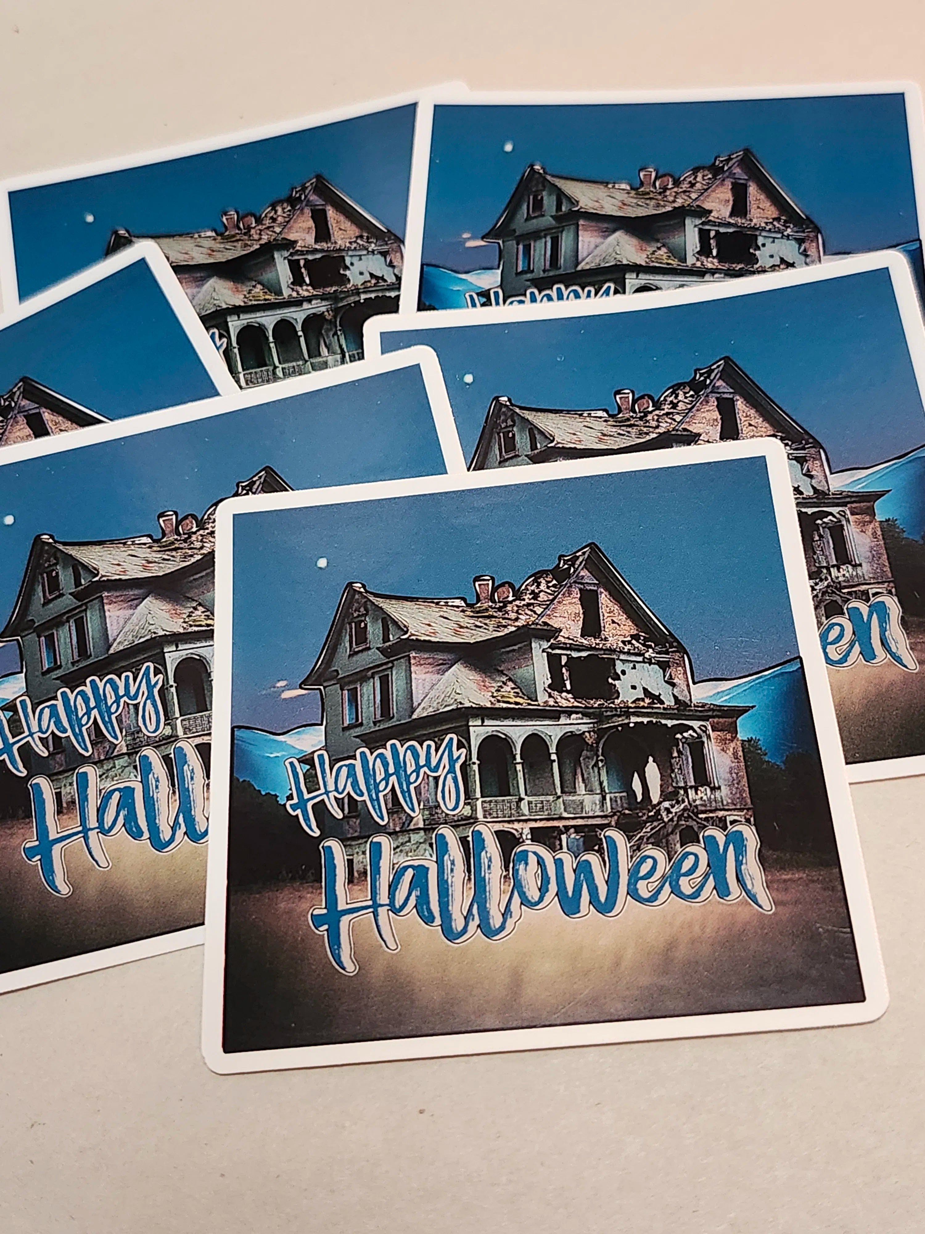 Set of Halloween-themed stickers with haunted house illustrations and 'Happy Halloween' text.