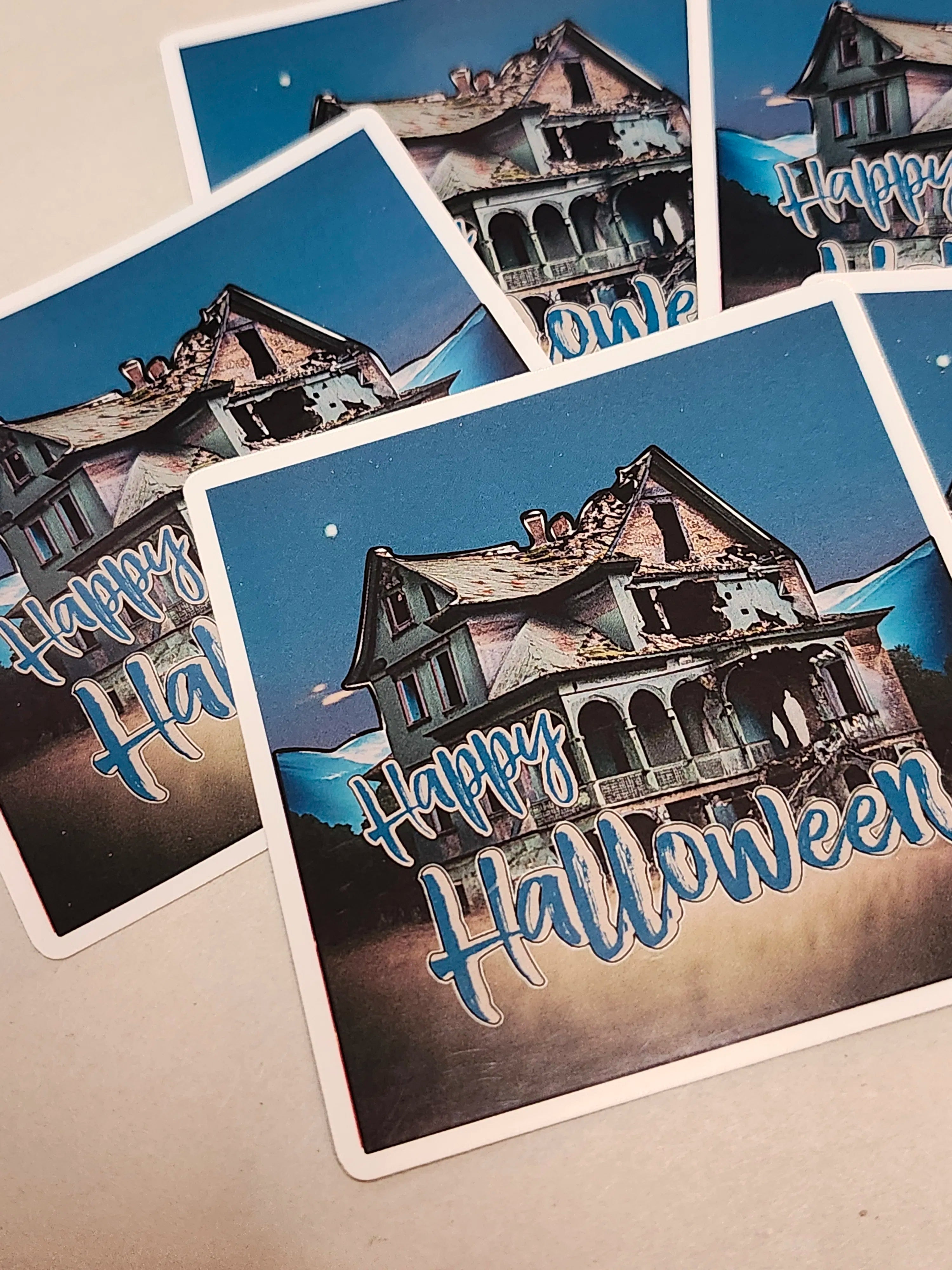 Halloween-themed stickers with haunted house design and 'Happy Halloween' text.