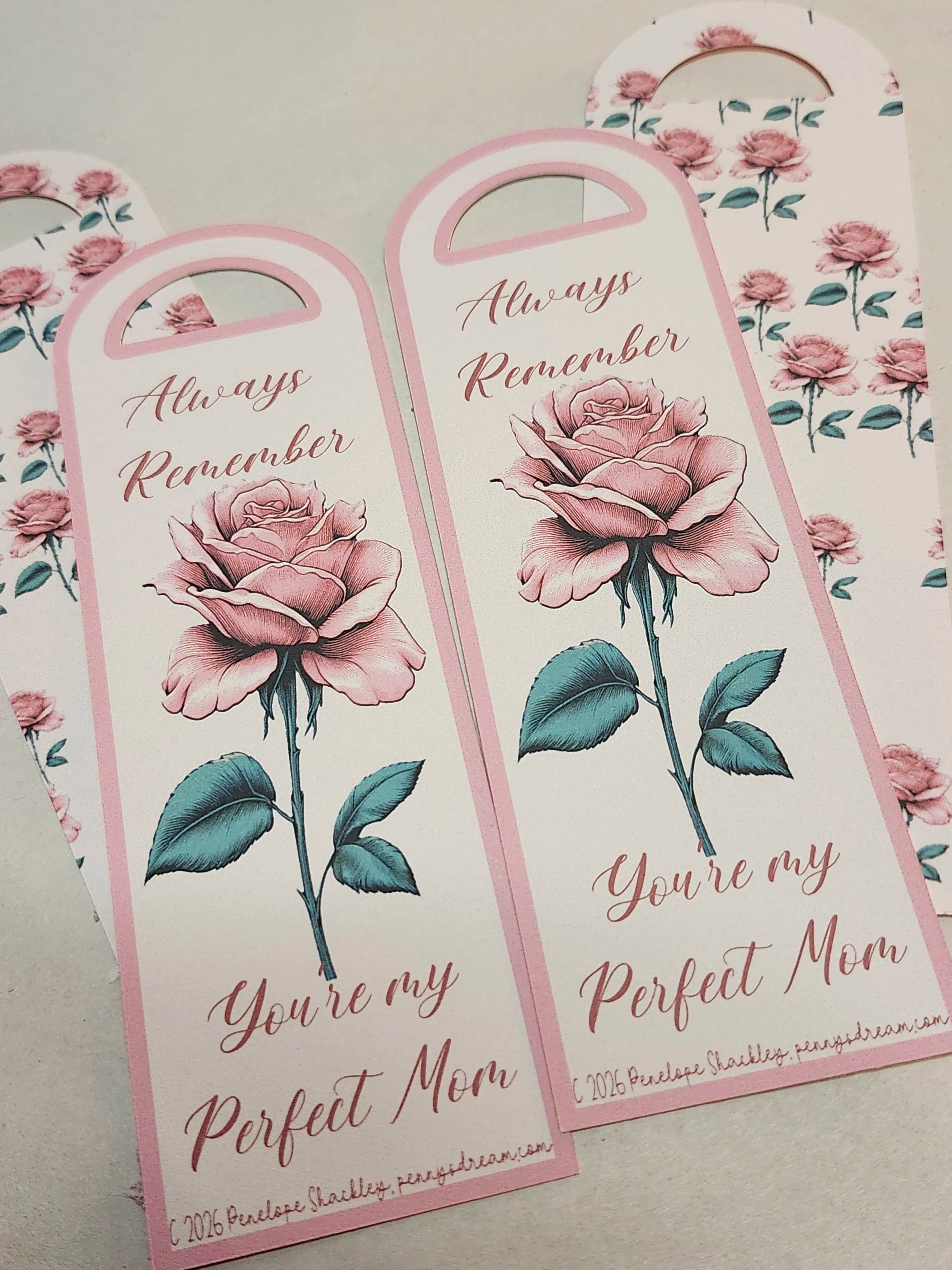 Decorative bookmarks with floral design and text on a light background